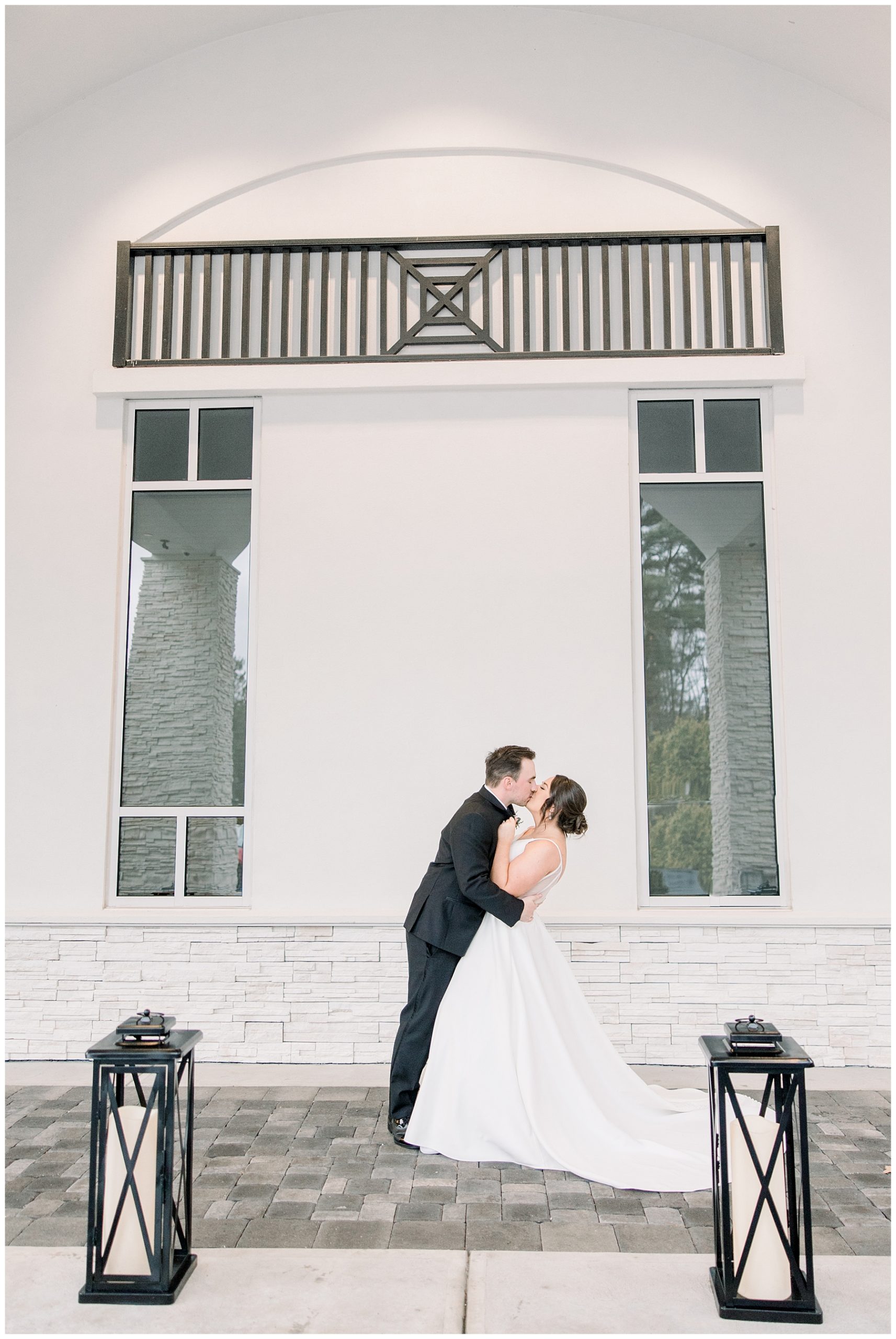 newlyweds kiss outside of Lakeview Pavilion 