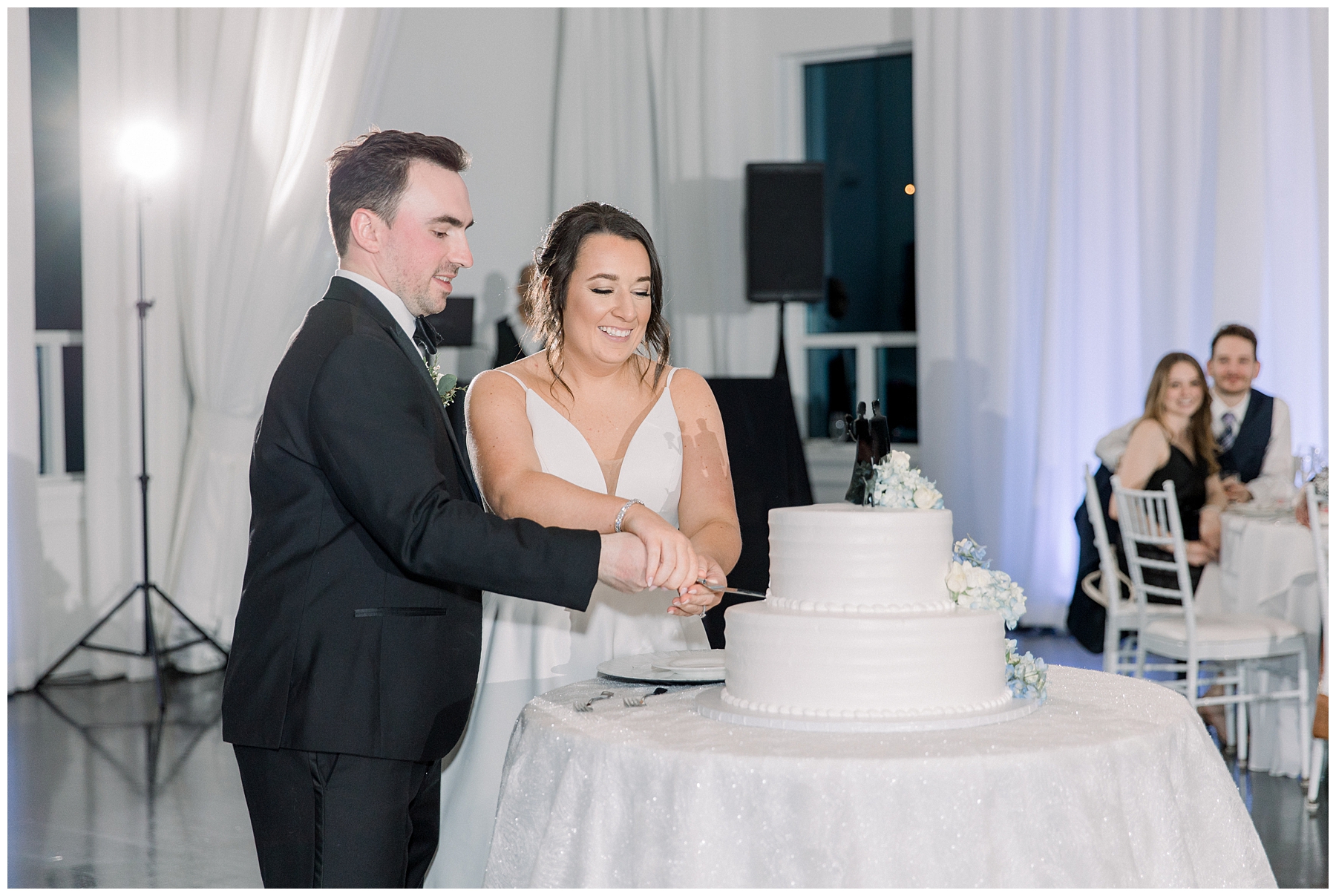 couple cut their wedding cake 