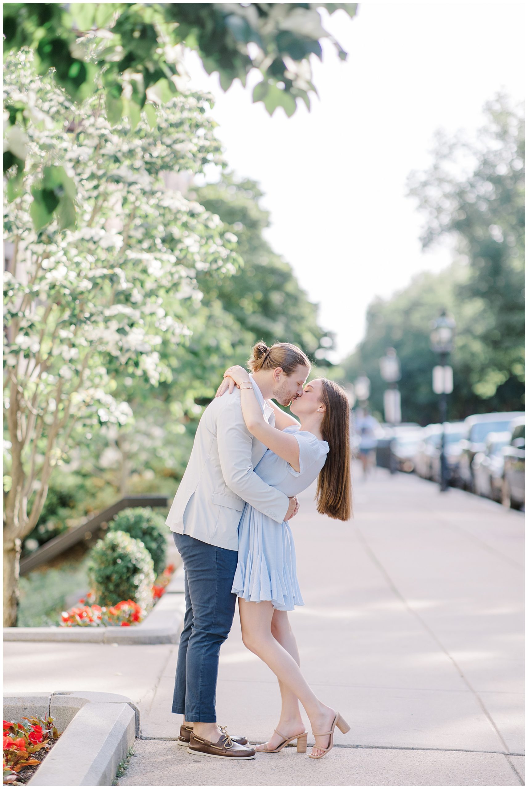 couple kiss on street in Boston during Downtown Boston Engagement Session