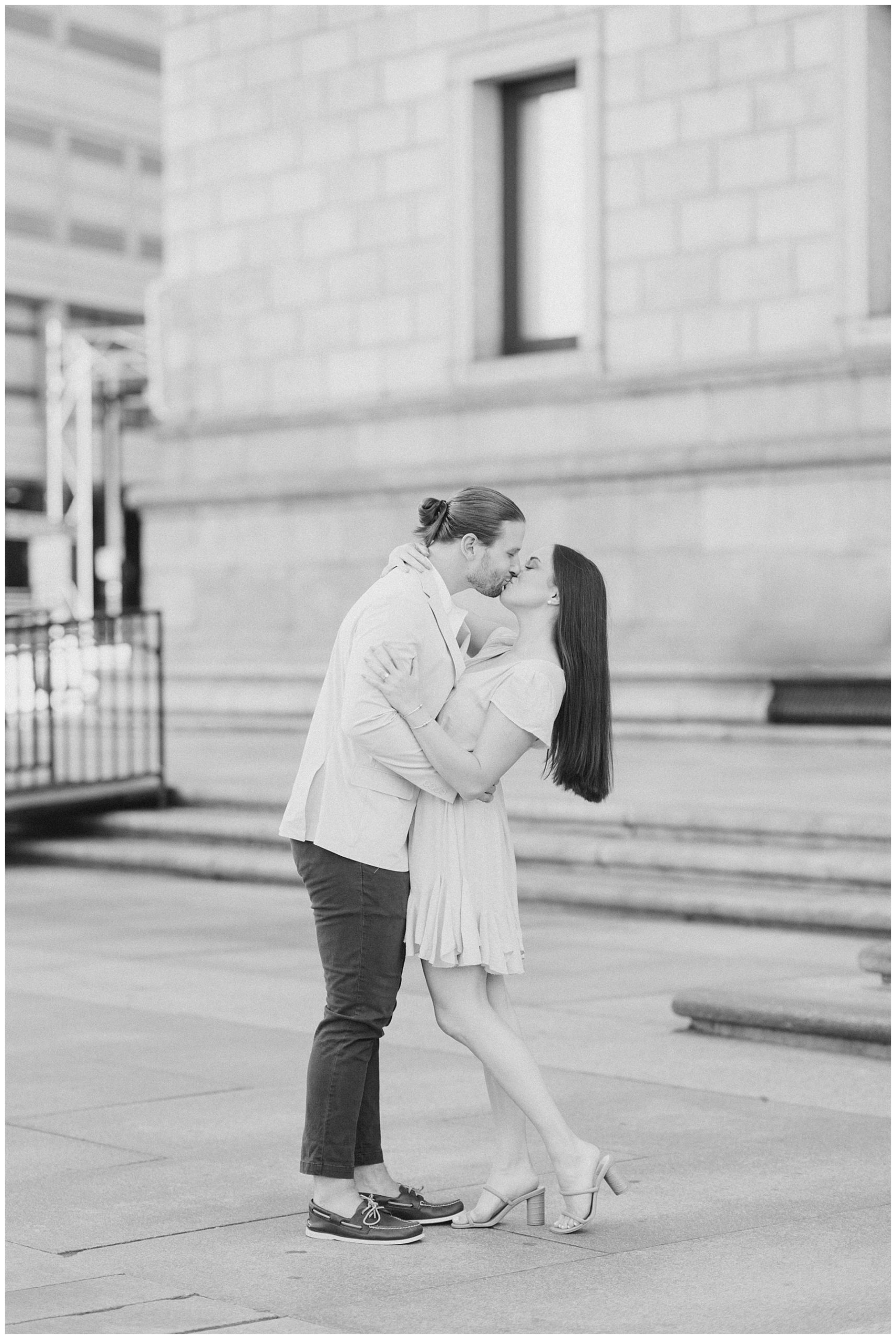 couple kiss during engagement portraits