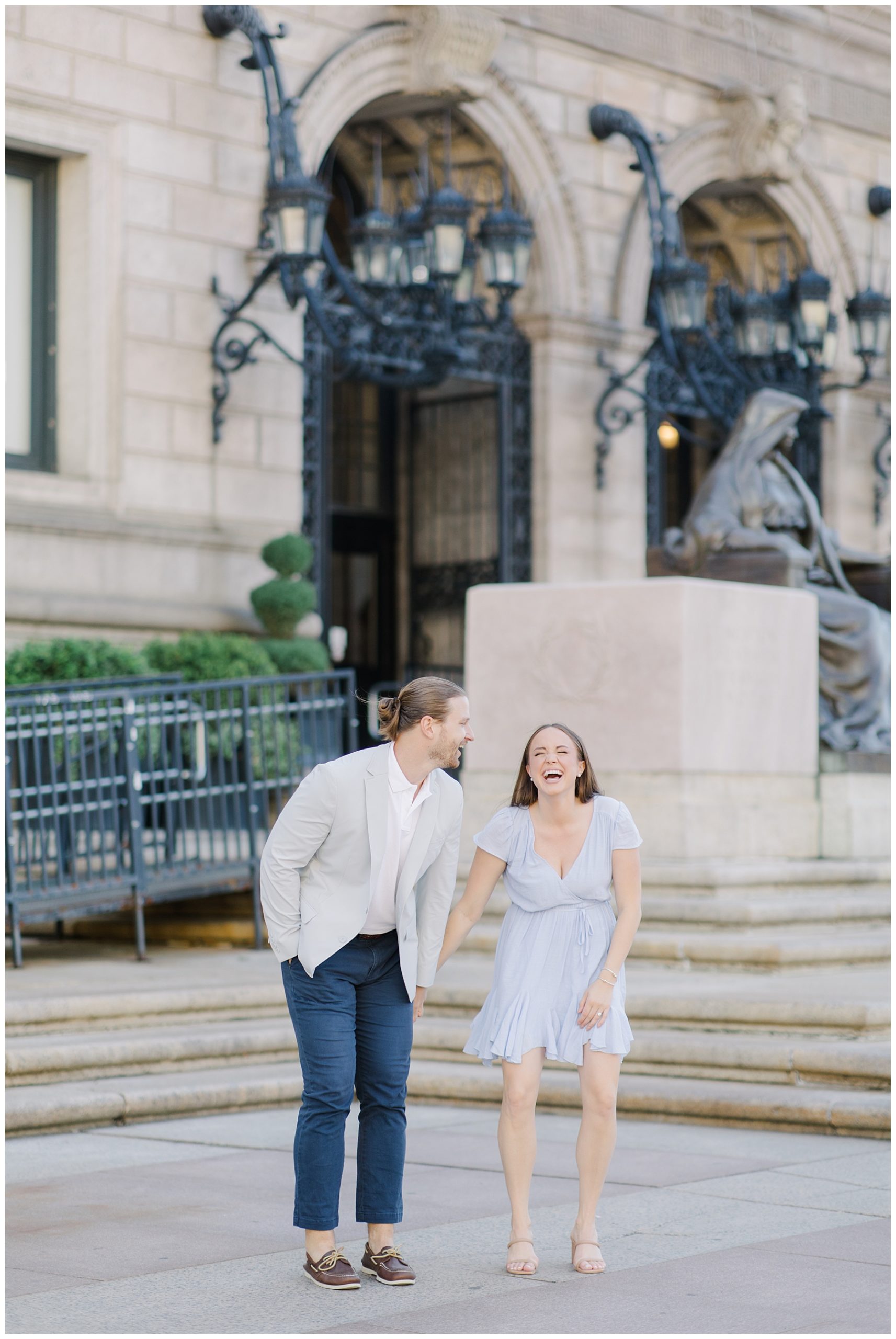 candid photo of couple sharing a laugh during engagement session