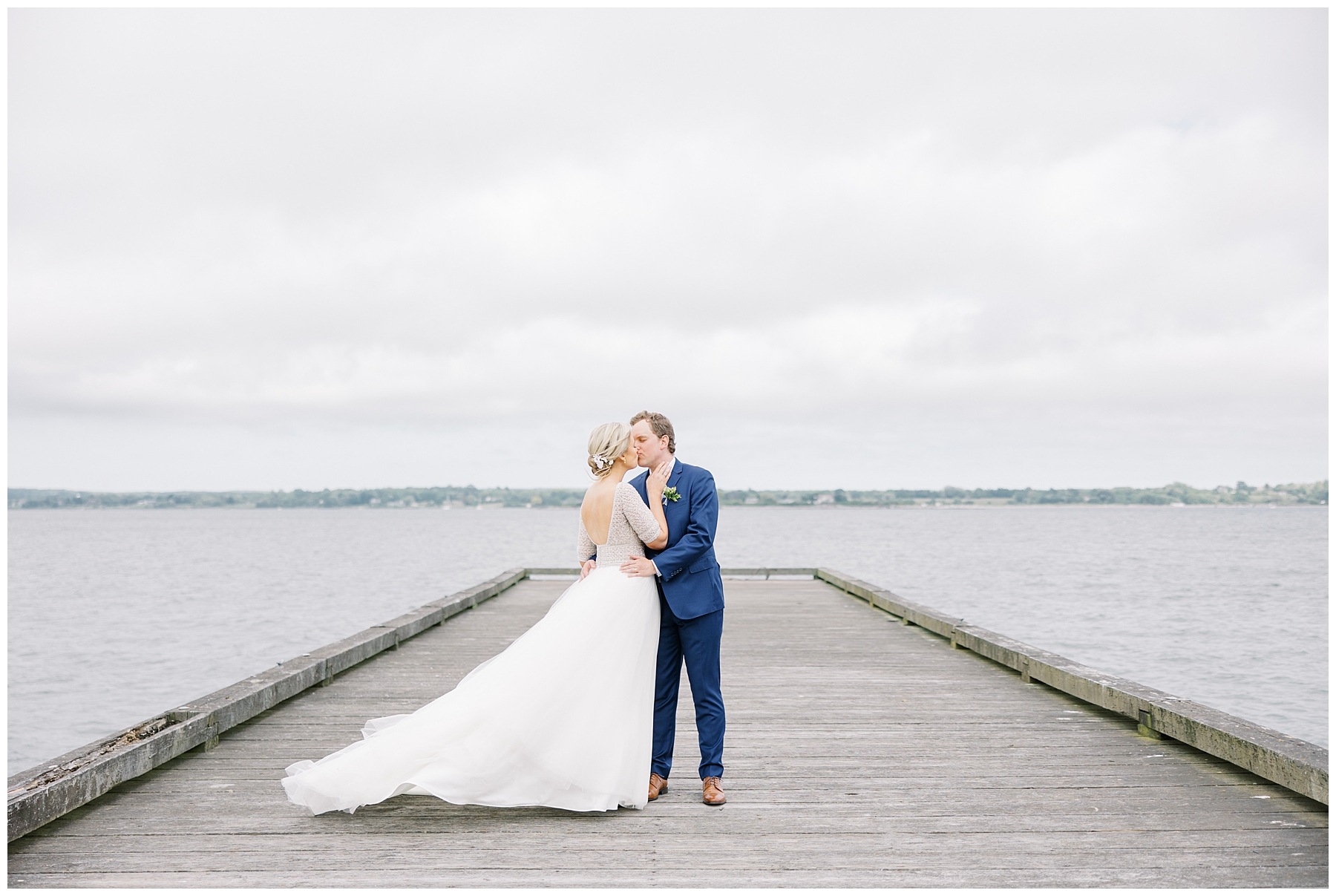 couple kiss out on the dock at Glen Manor House