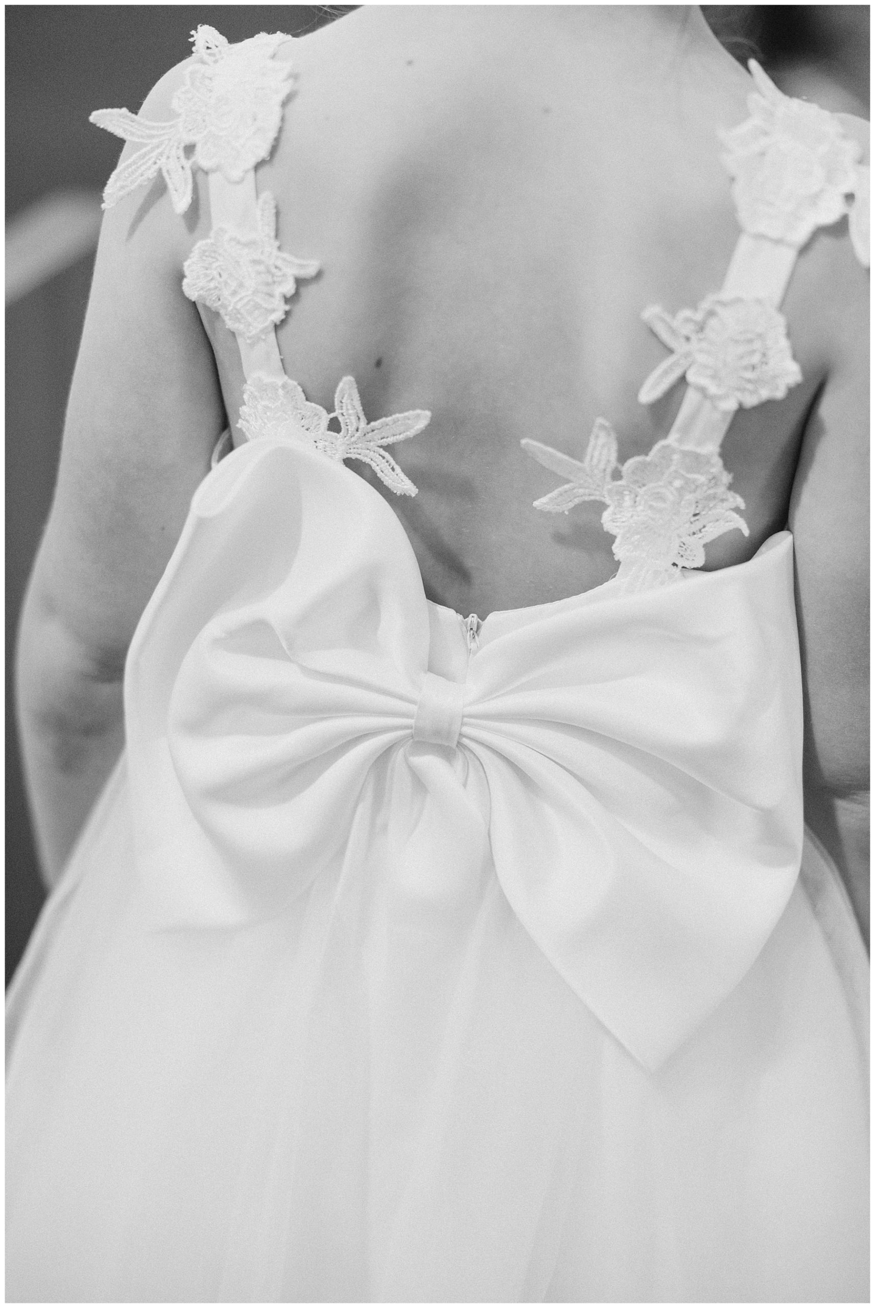 bow on back of bride's wedding dress