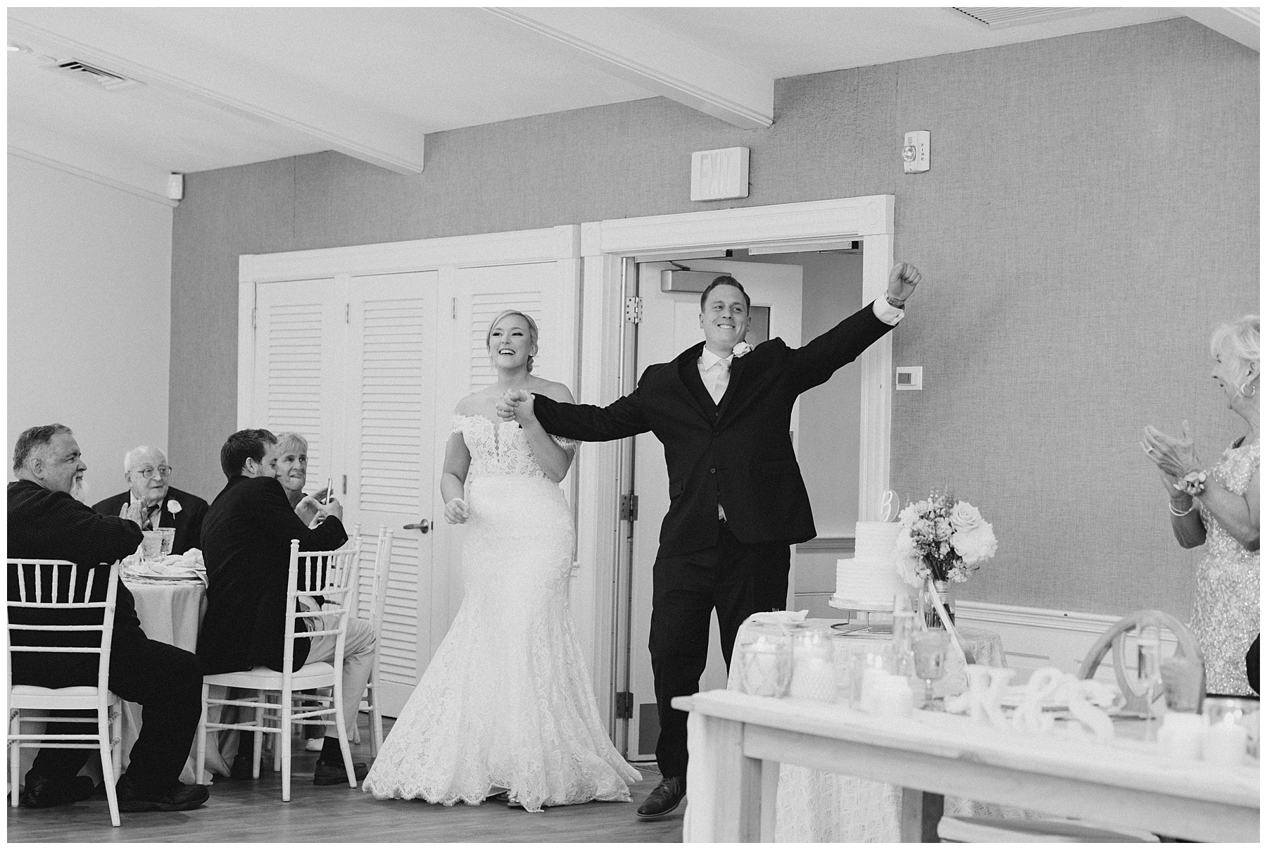 Cape Cod Wedding Photographer captures bride and groom walking into reception at Wychmere Beach Club