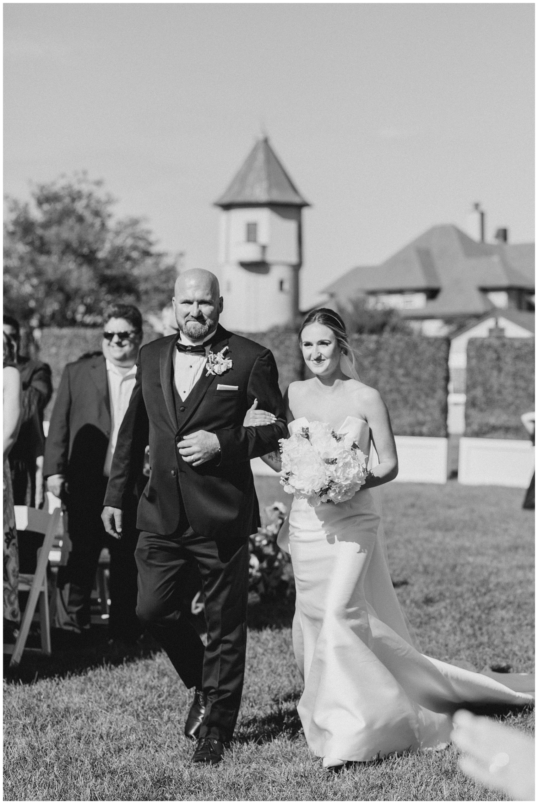 bride walking down the aisle with dad 