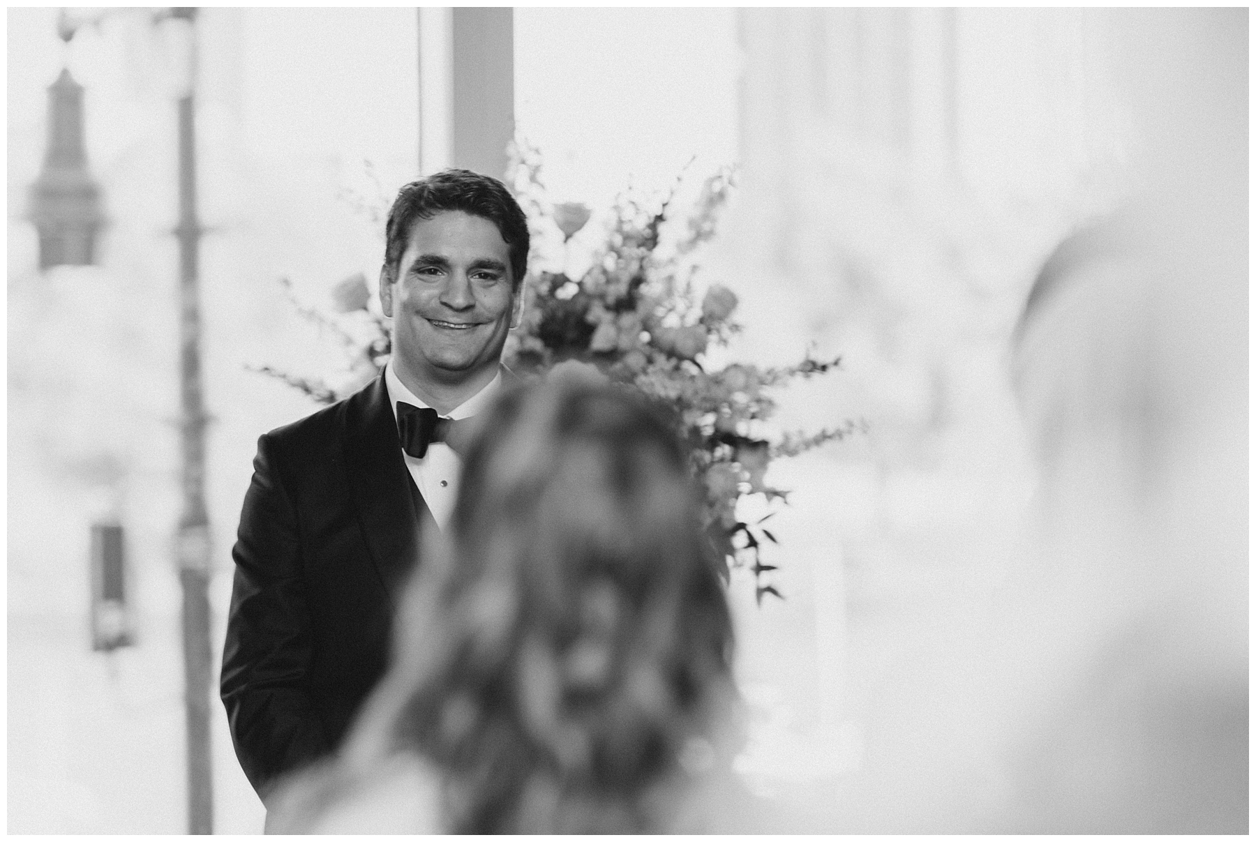 groom smiles seeing his bride at Royal Sonesta Wedding ceremony