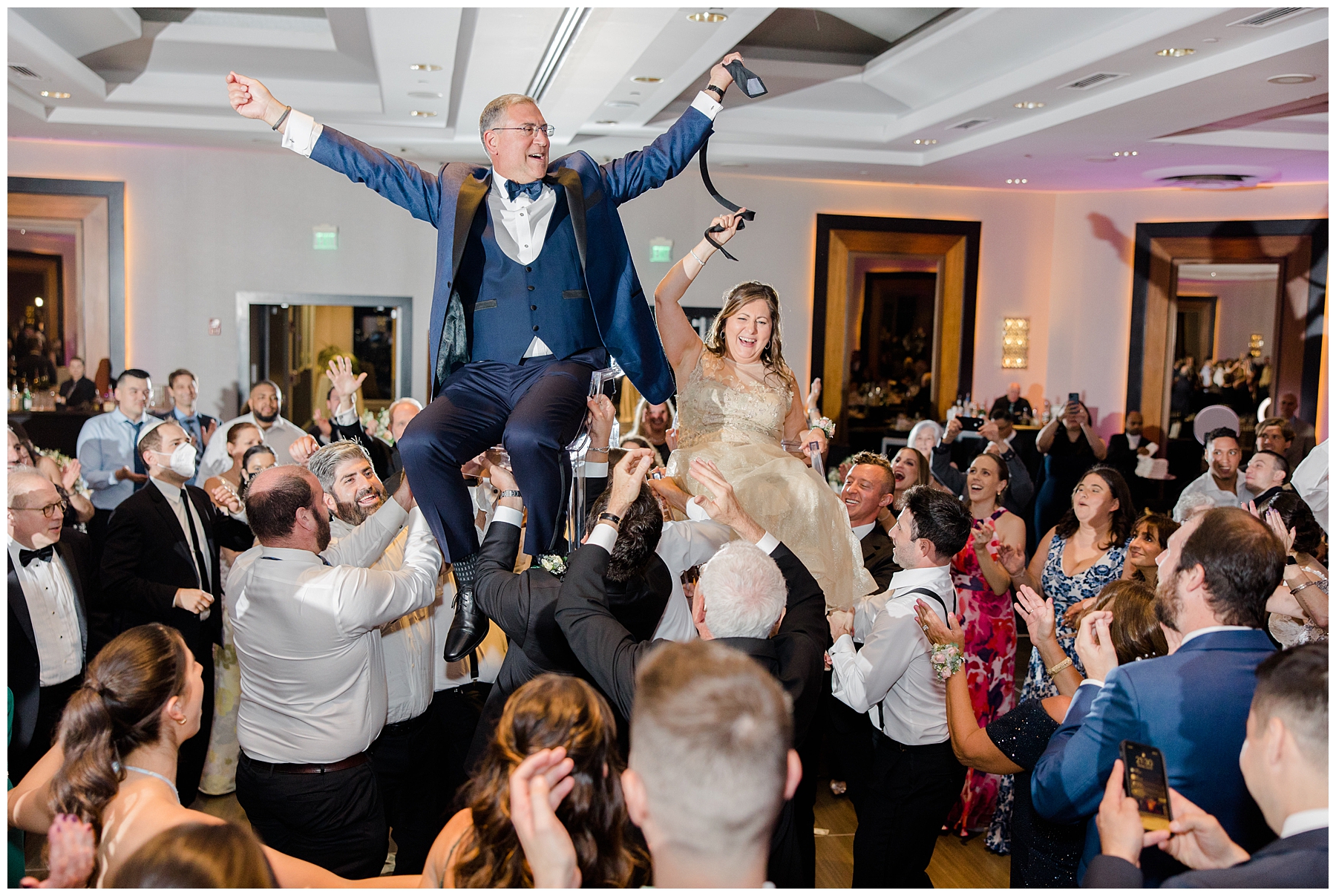 guests lift man during reception 