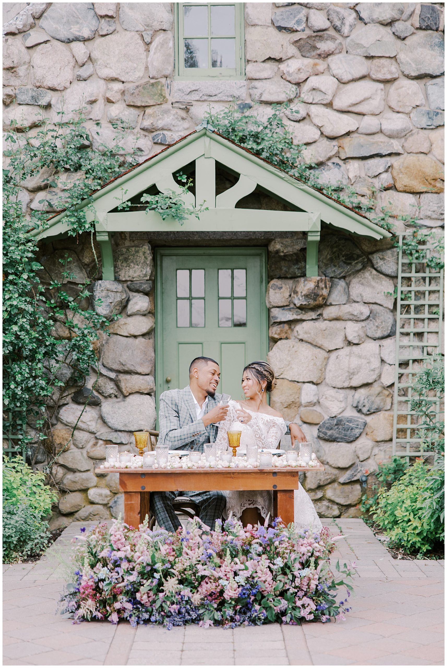 couple sit at sweetheart table during Dreamy Scotland in the Spring inspired Willowdale Estate Wedding