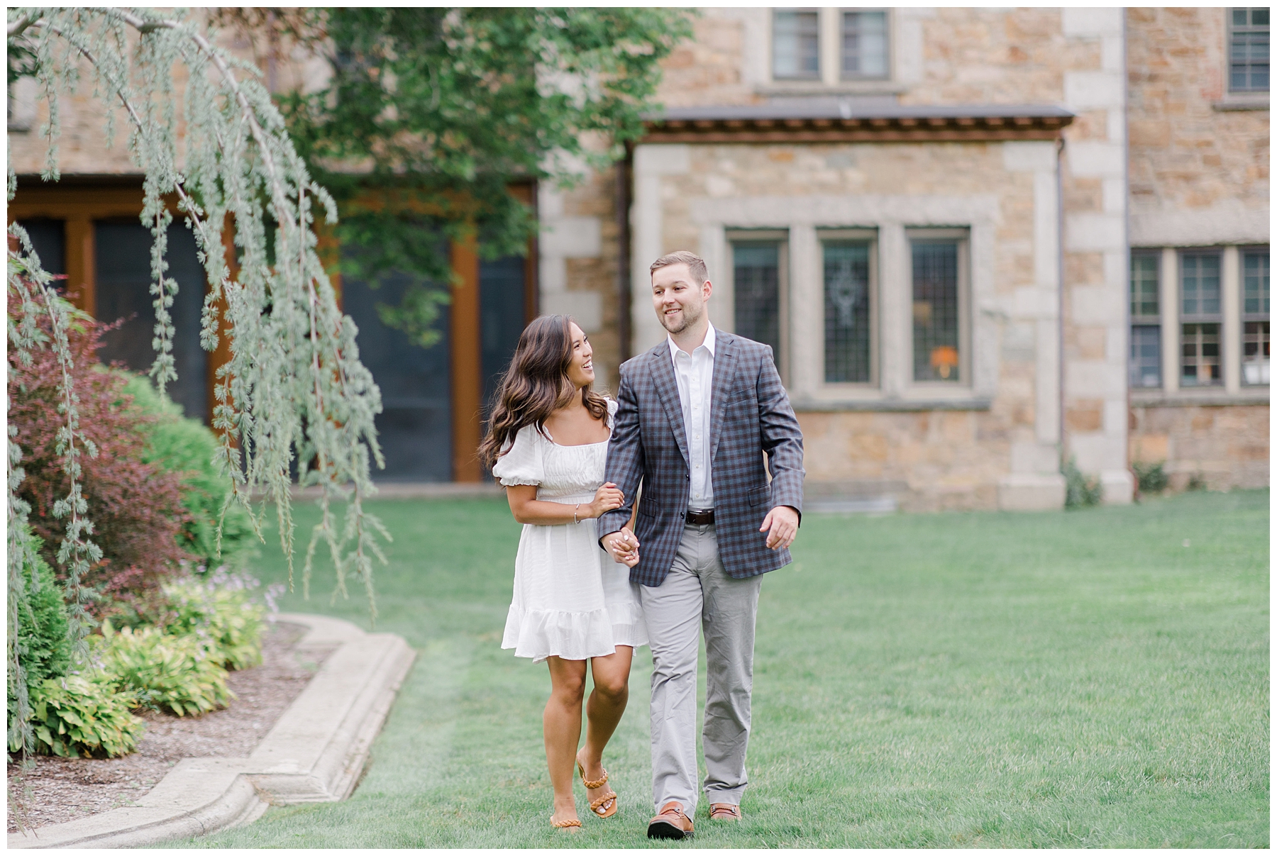 couple walk together at estate in Boston