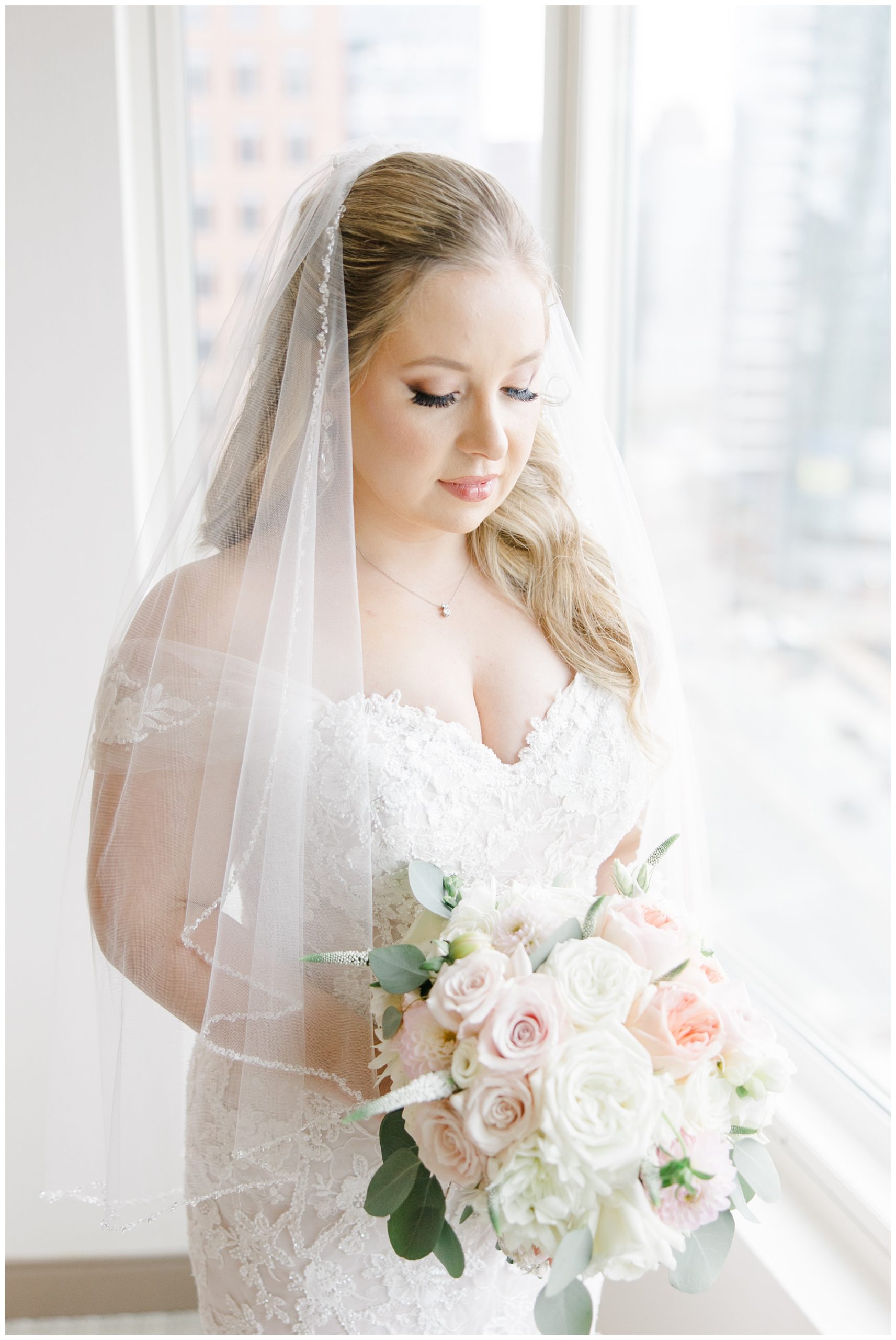 bride holding classic wedding bouquets 