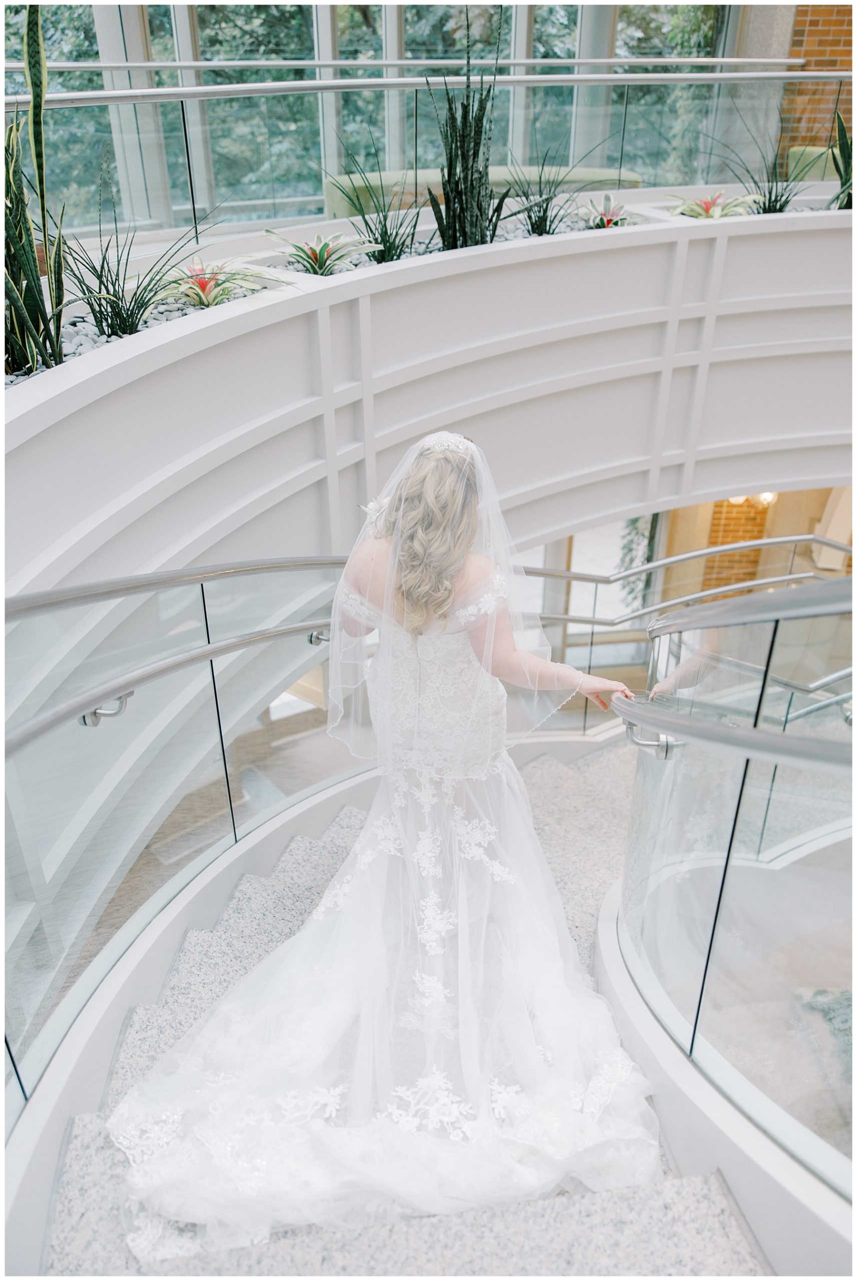 bride walking down stairs at seaport hotel to surprise groom