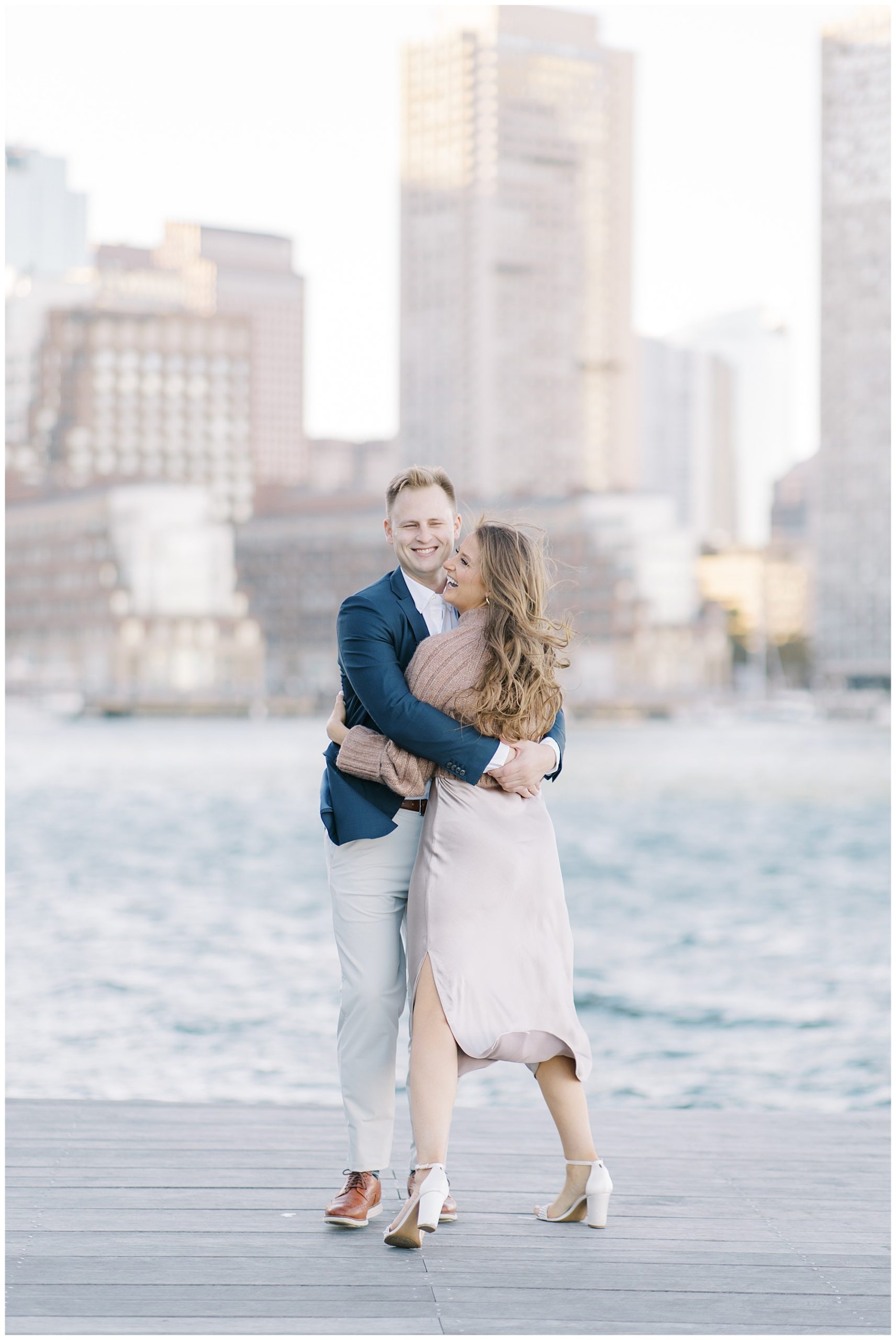 candid engagement portraits in South Boston at Seaport