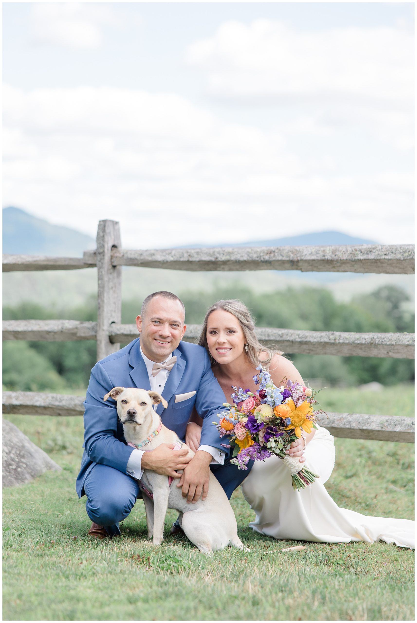 bride and groom with their dog after wedding in Vermont