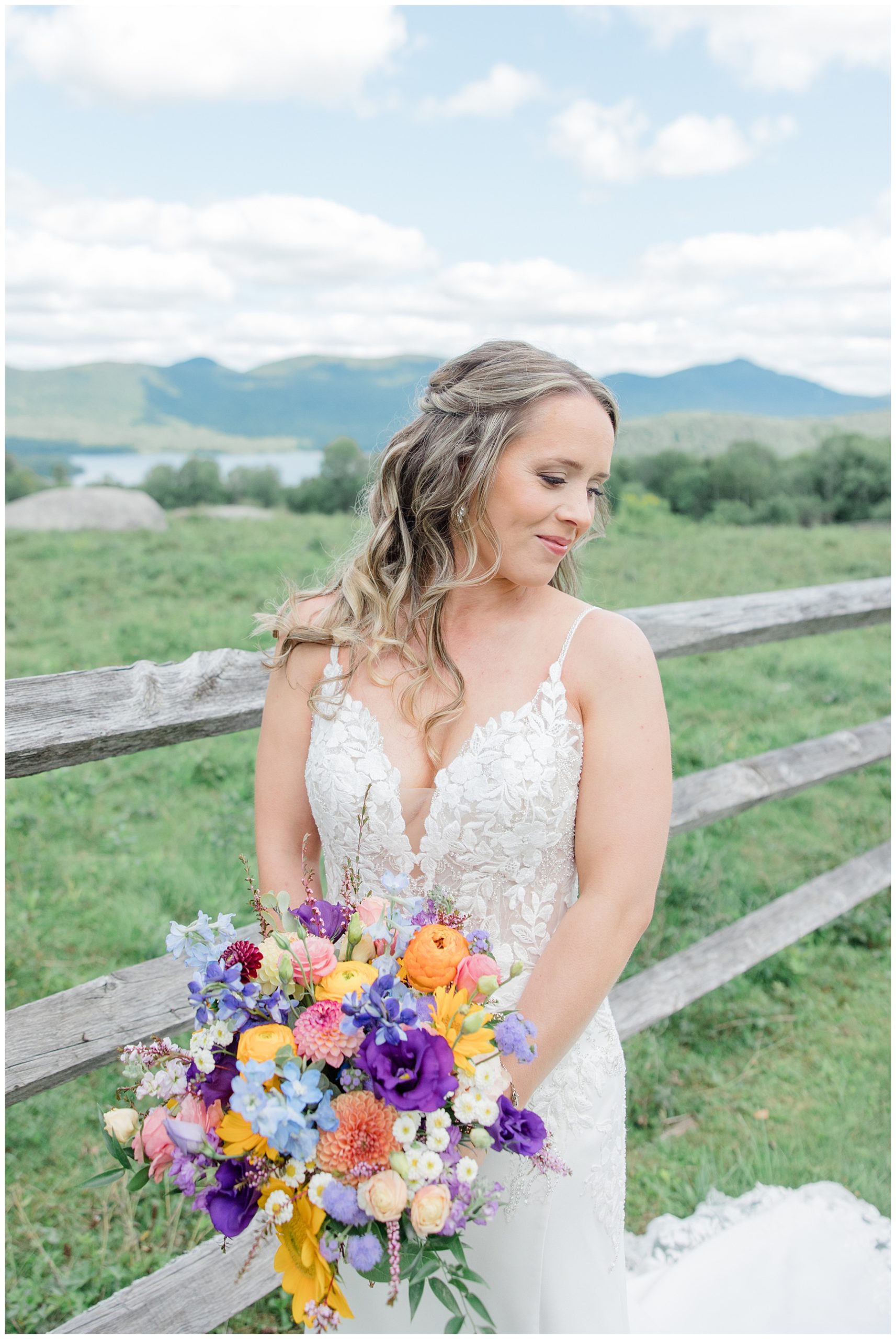 bride on Vermont hillside with mountains in the background