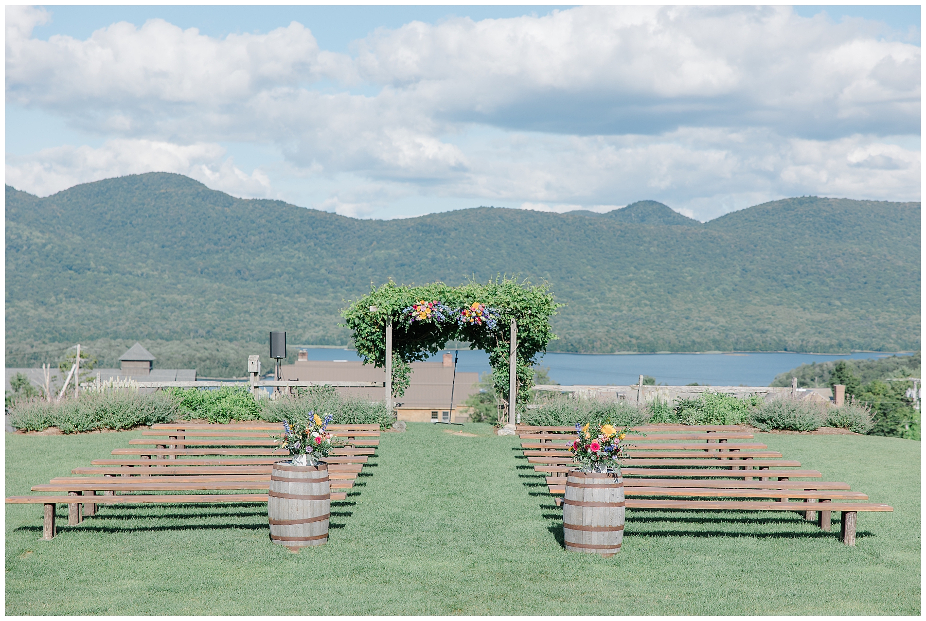 dreamy outdoor wedding ceremony overlooking lake and mountains 