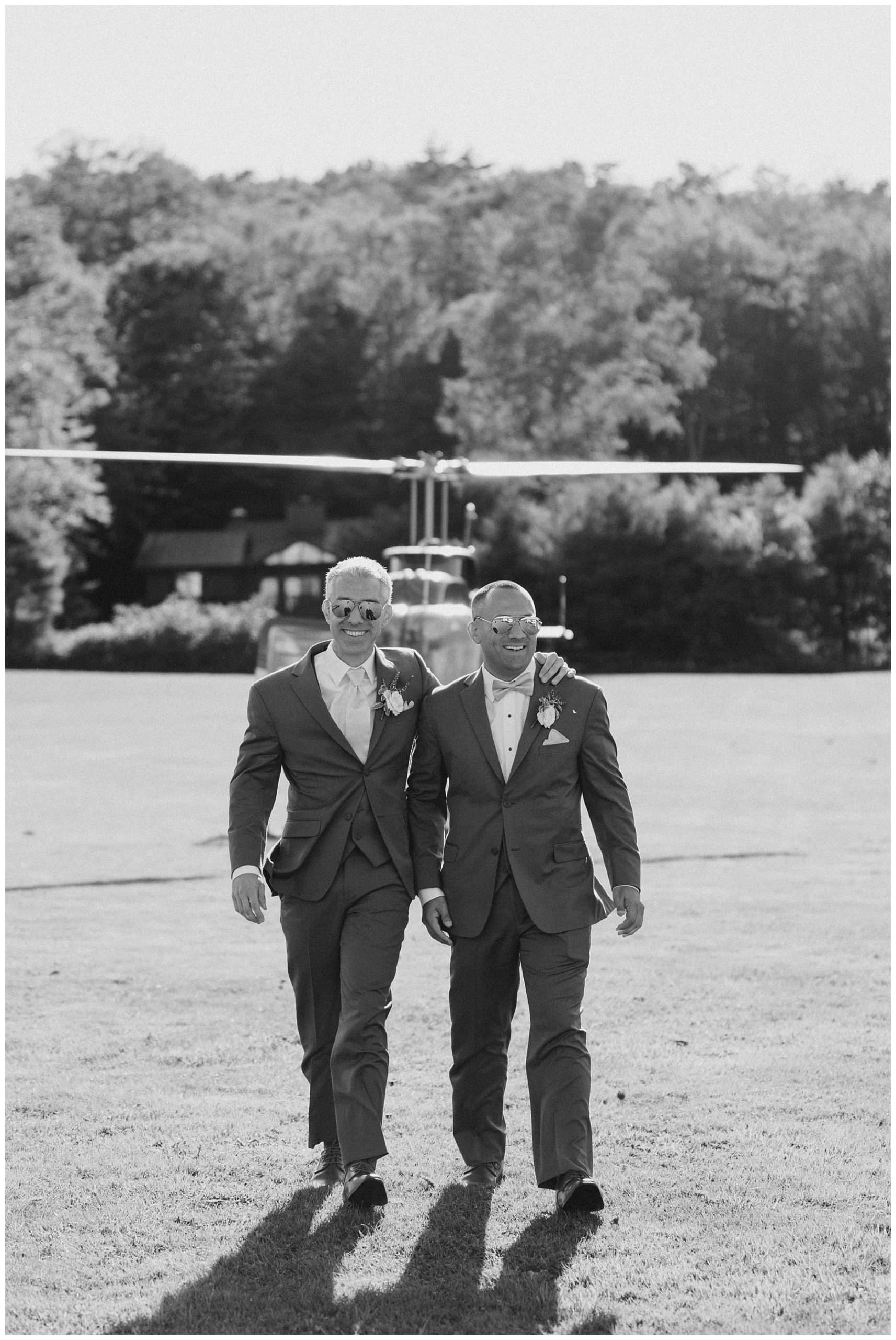 groom and best man arrive to wedding on a helicopter 