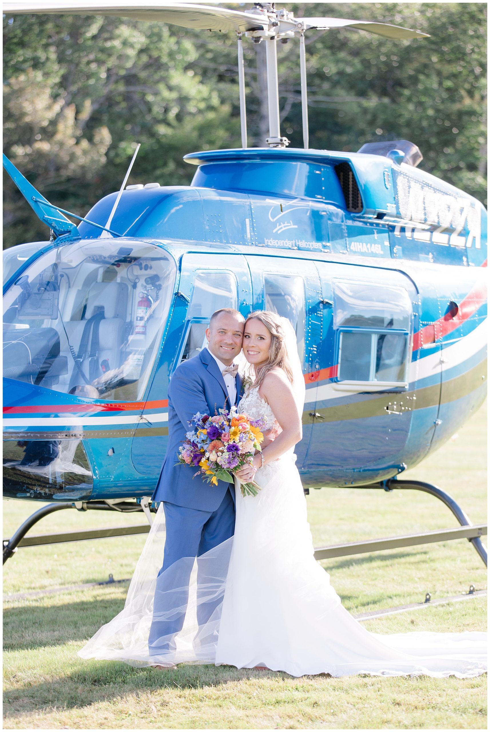 couple in front of helicopter at Vermont wedding