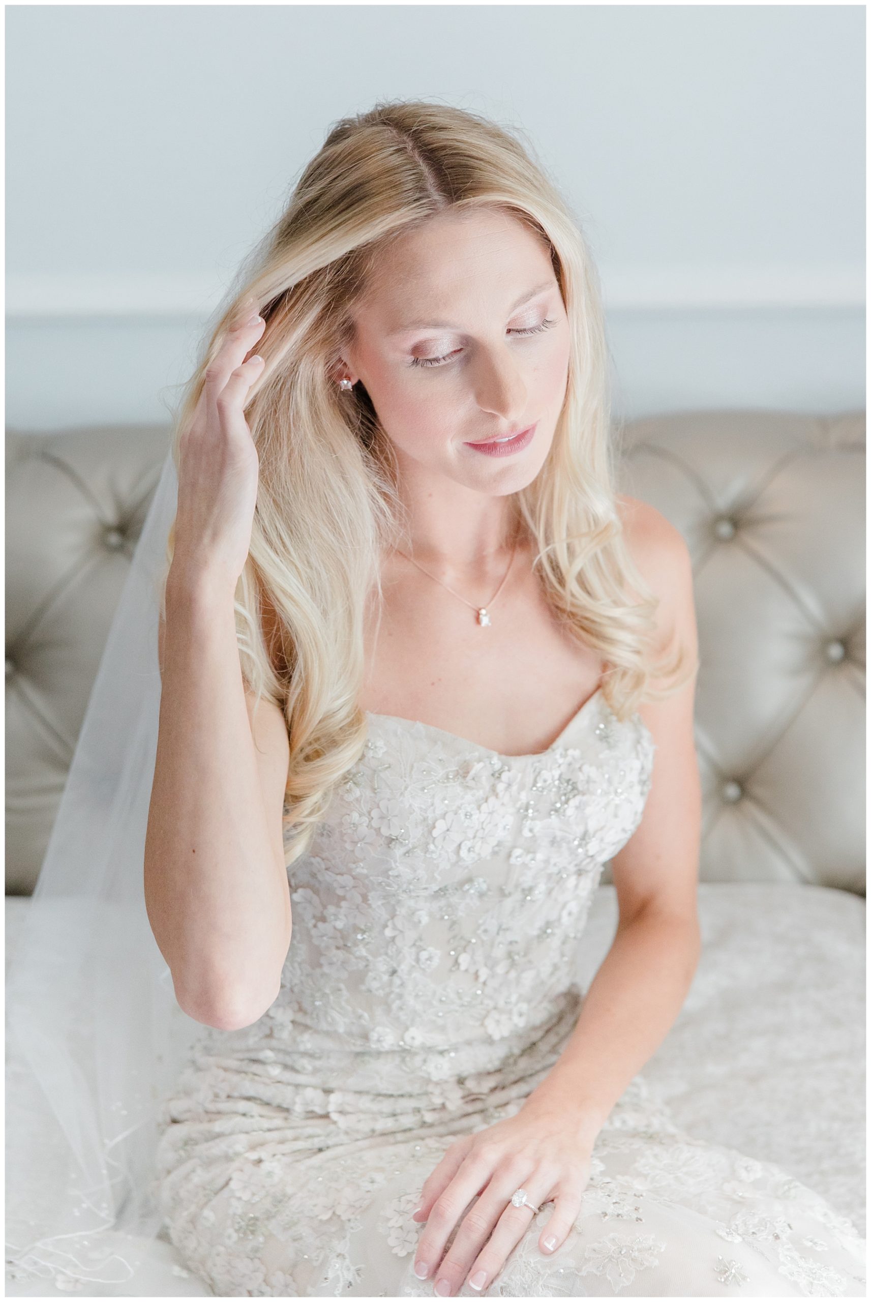 bride brushes hair back from face