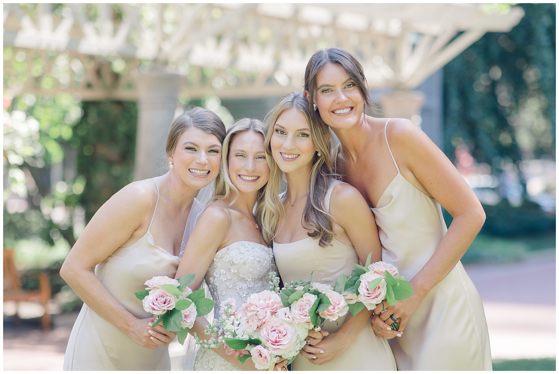 bride and bridesmaids in champagne dresses