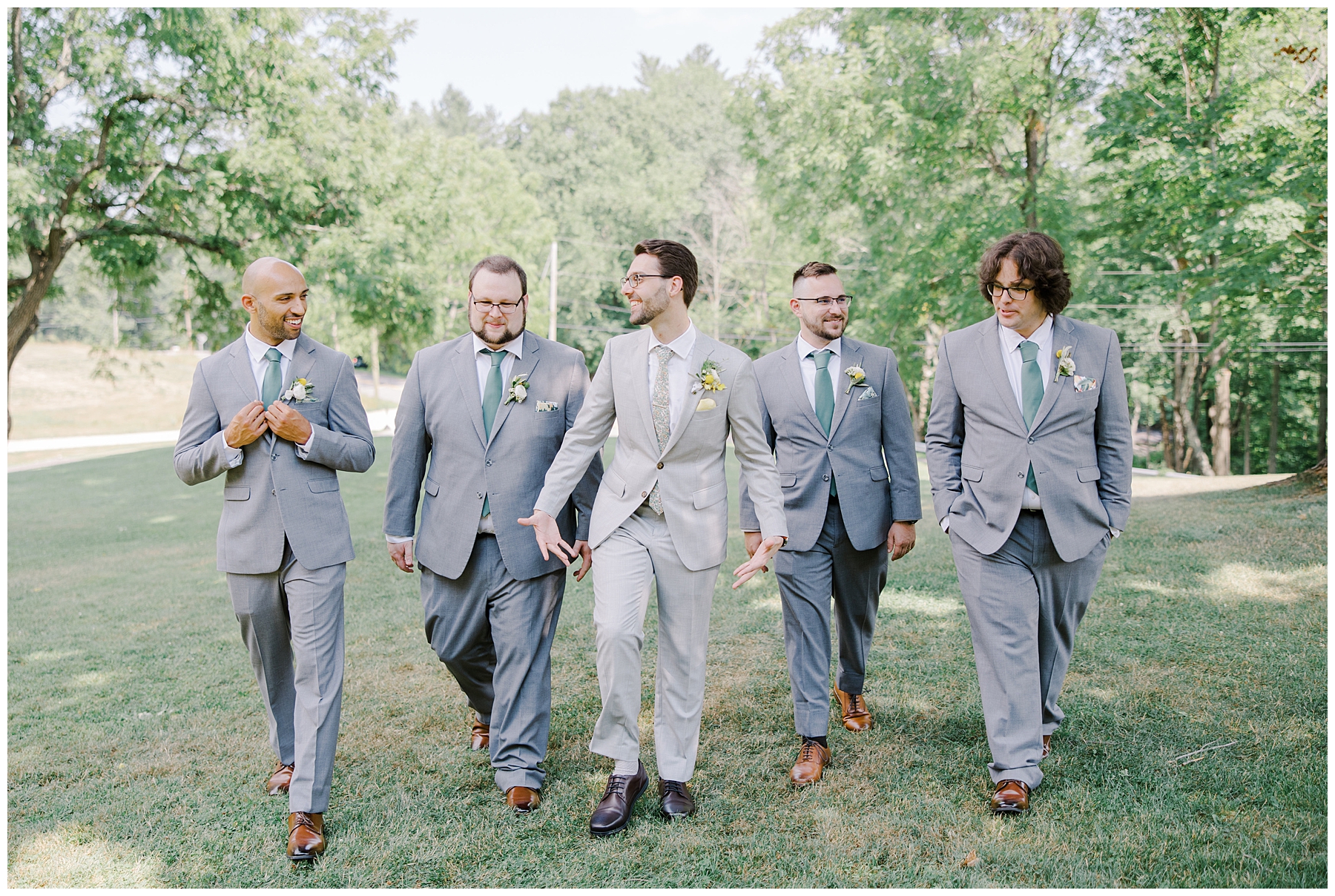 groom walks with his groomsmen
