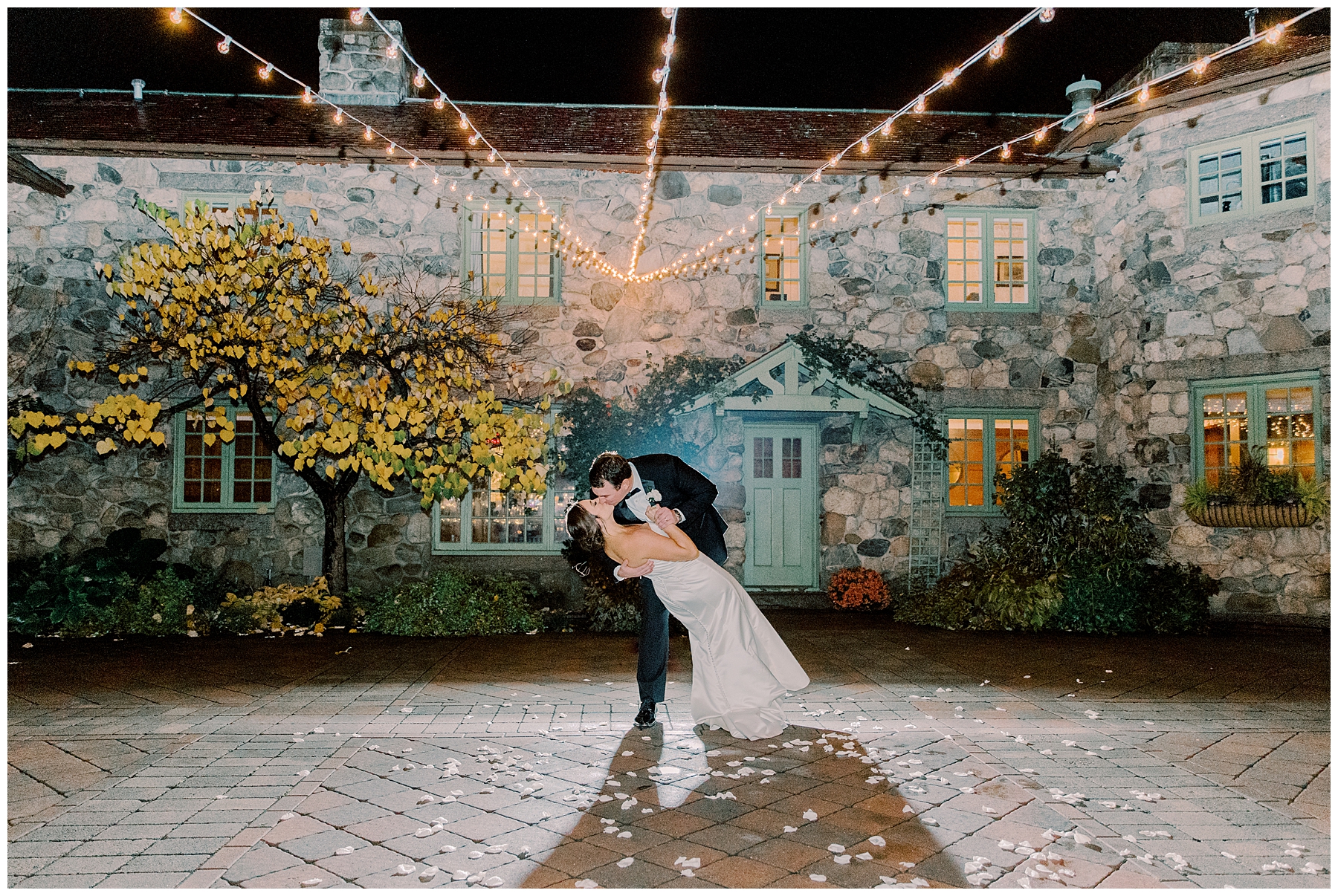 couple kiss at the end of their Willowdale Estate Fall Wedding 