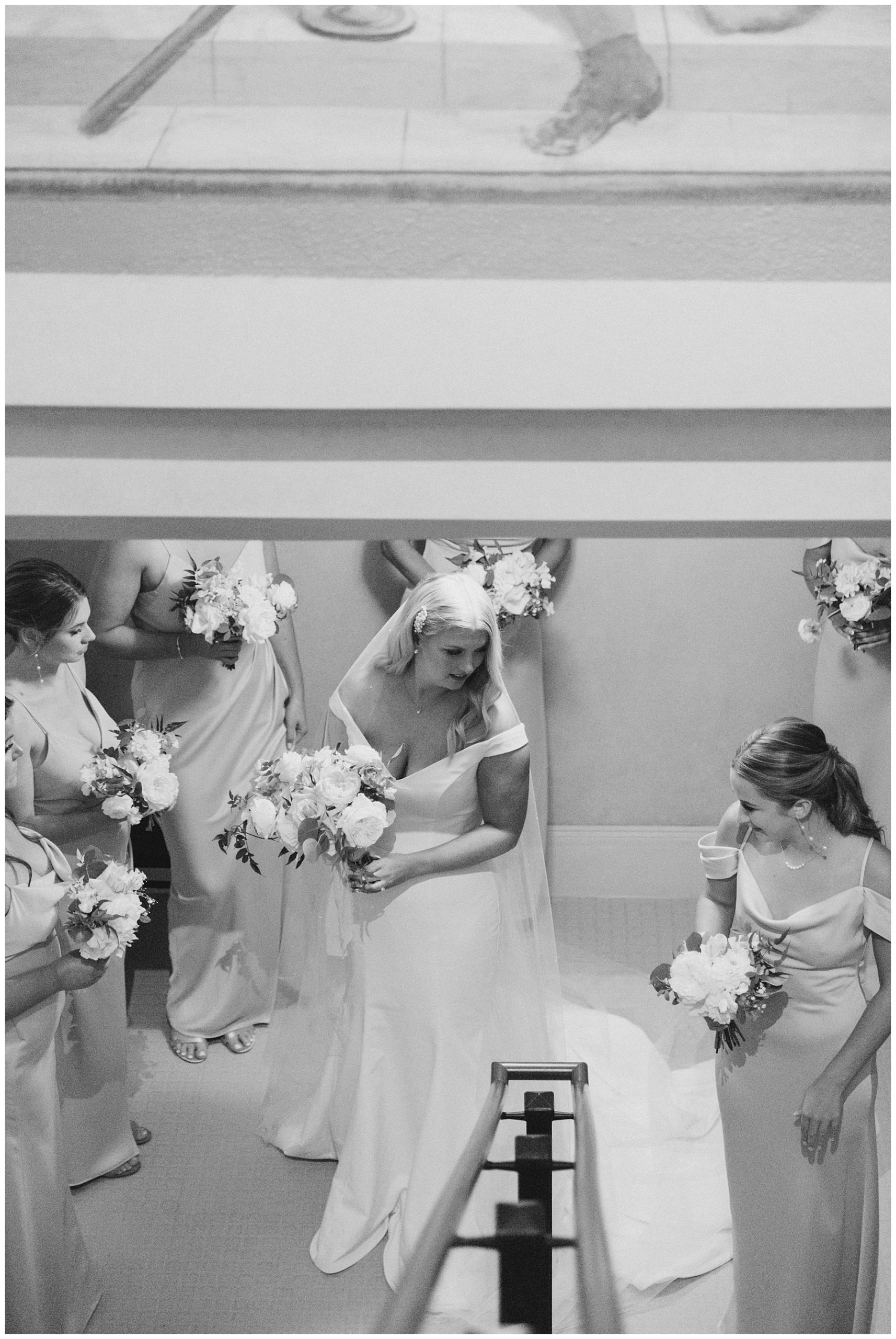bride and bridesmaids get ready to head down the aisle 
