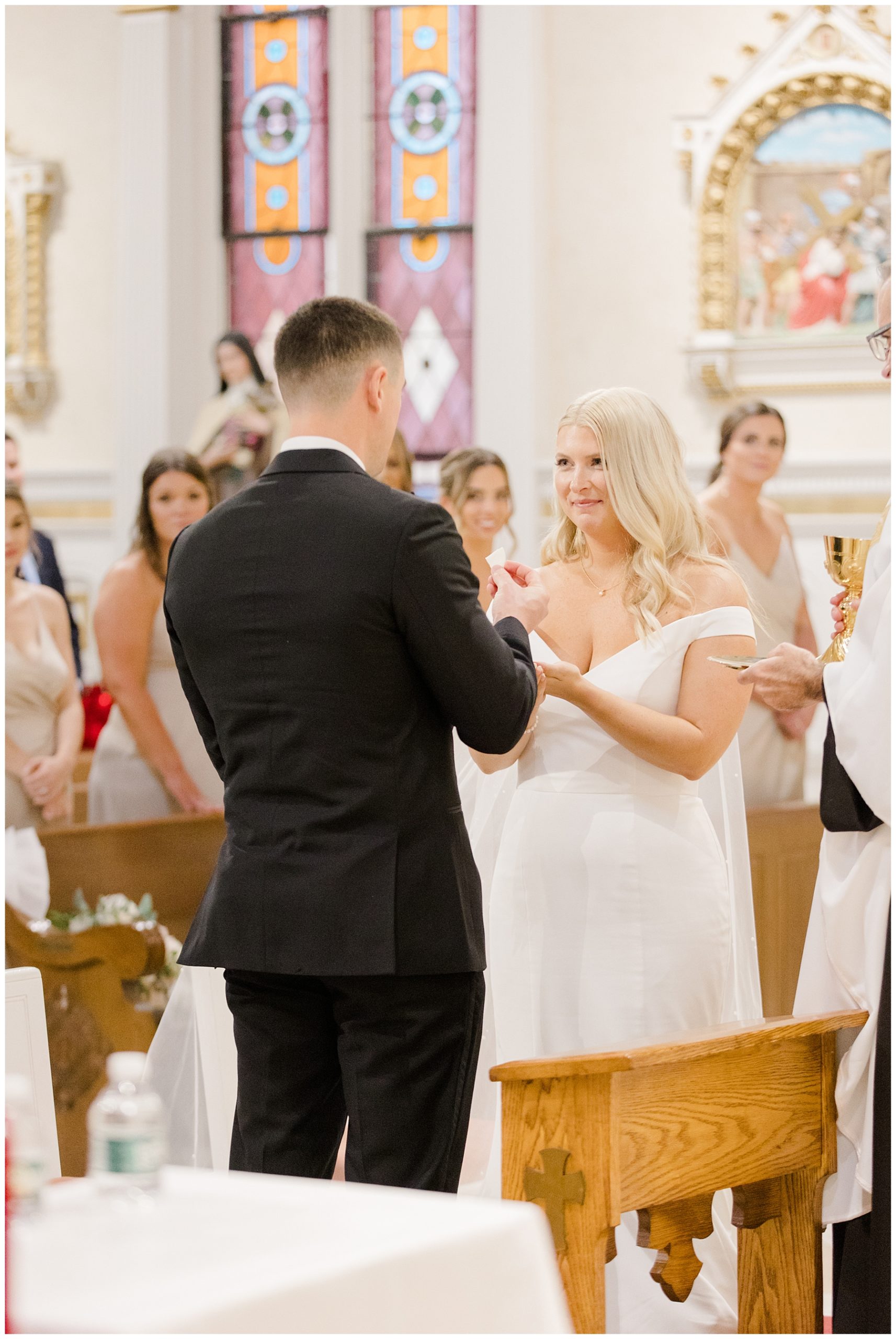 bride and groom exchange rings during Boston wedding ceremony
