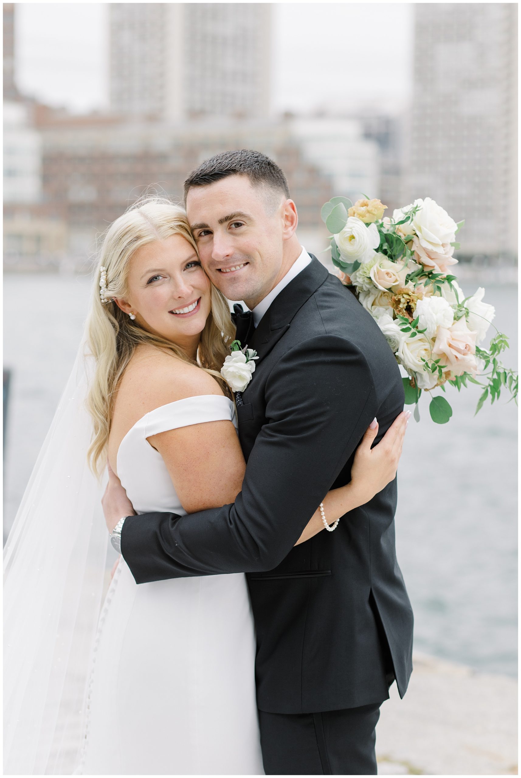 couple embrace during Boston City Dream Wedding 