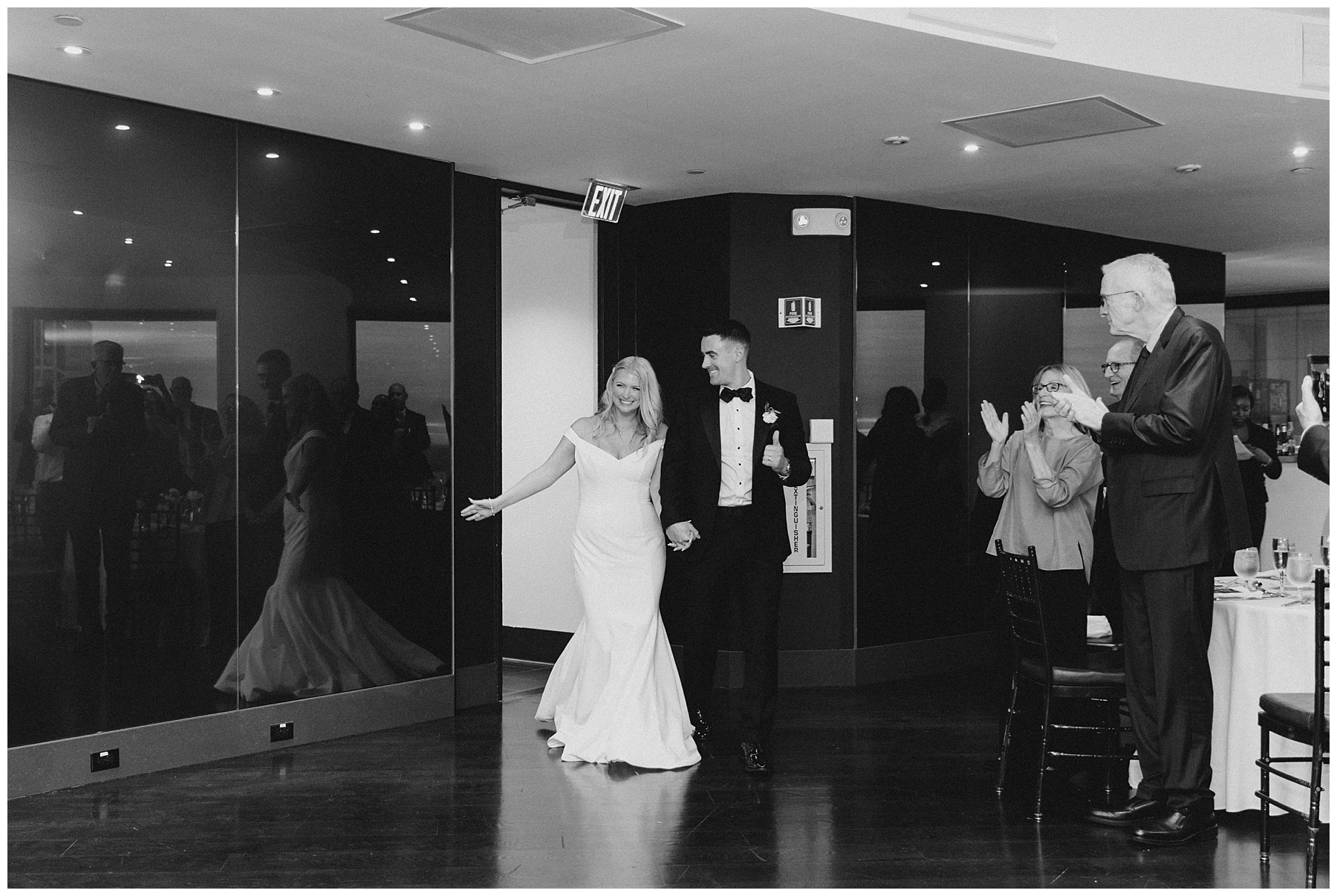 newlyweds enter wedding reception 