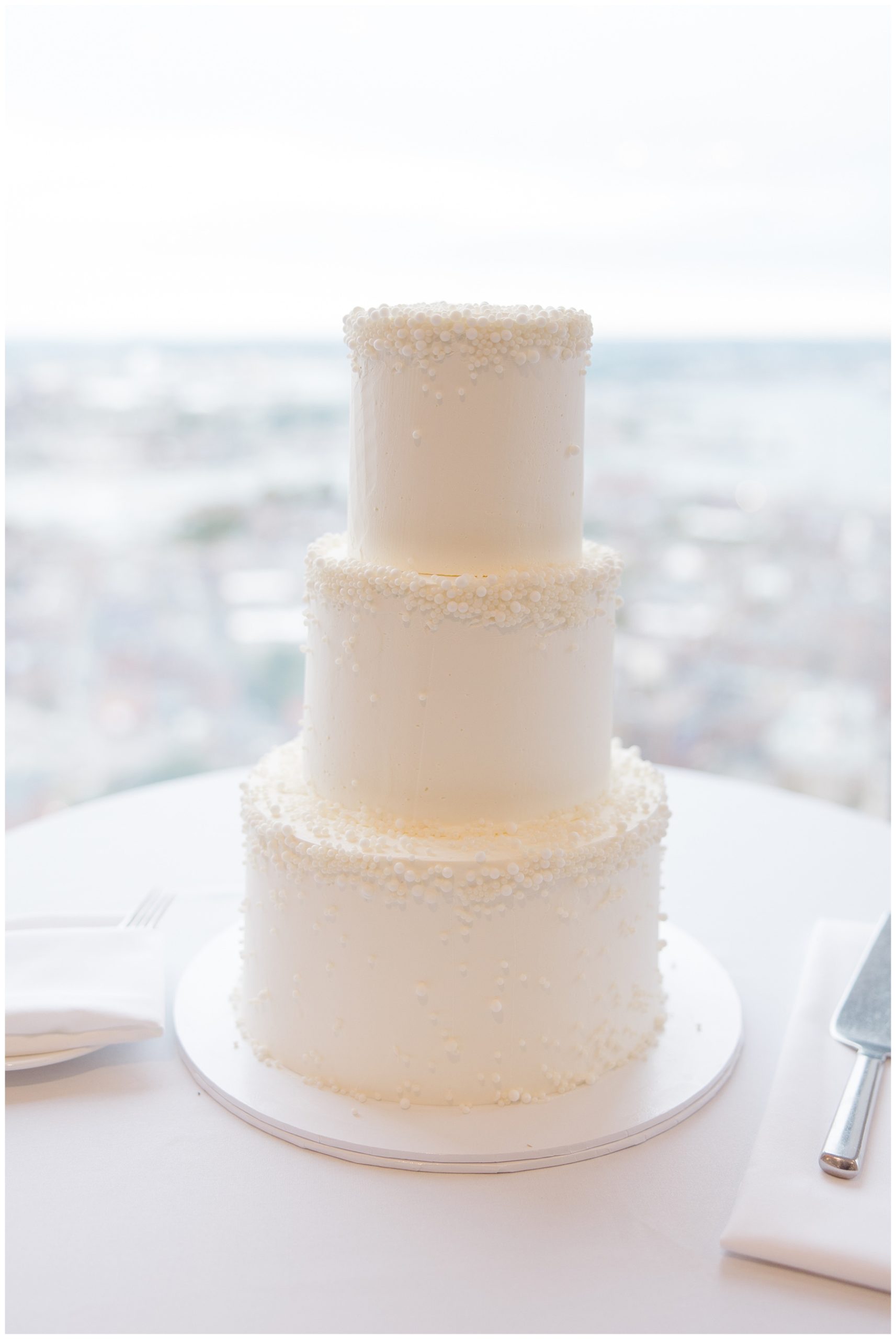 classic three tiered white wedding cake