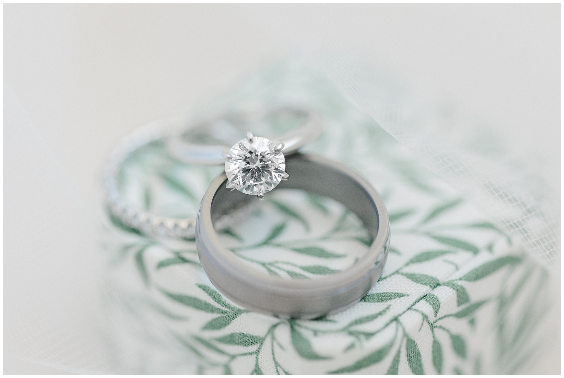 wedding rings on green leaf design