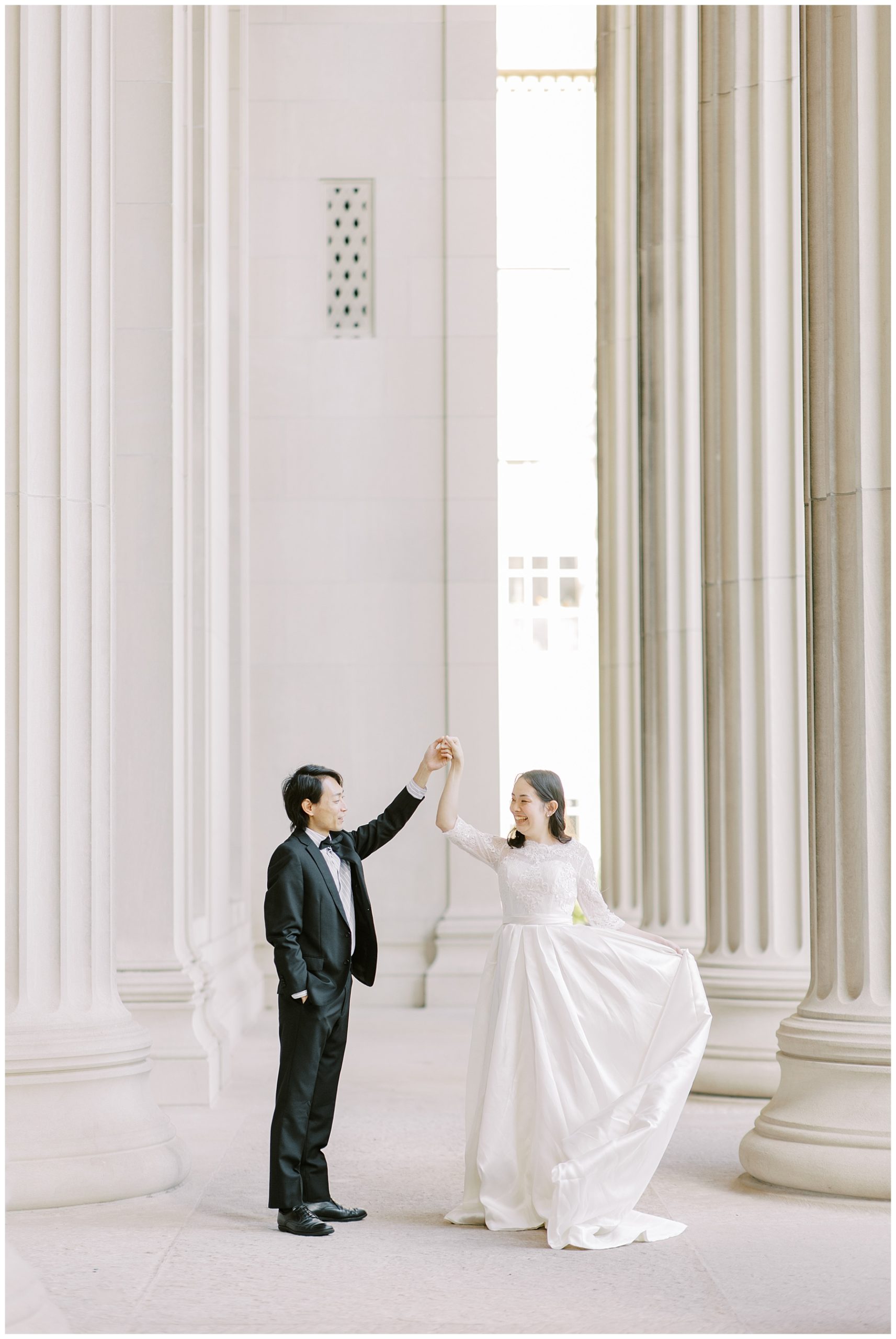couple dance together during wedding portraits 