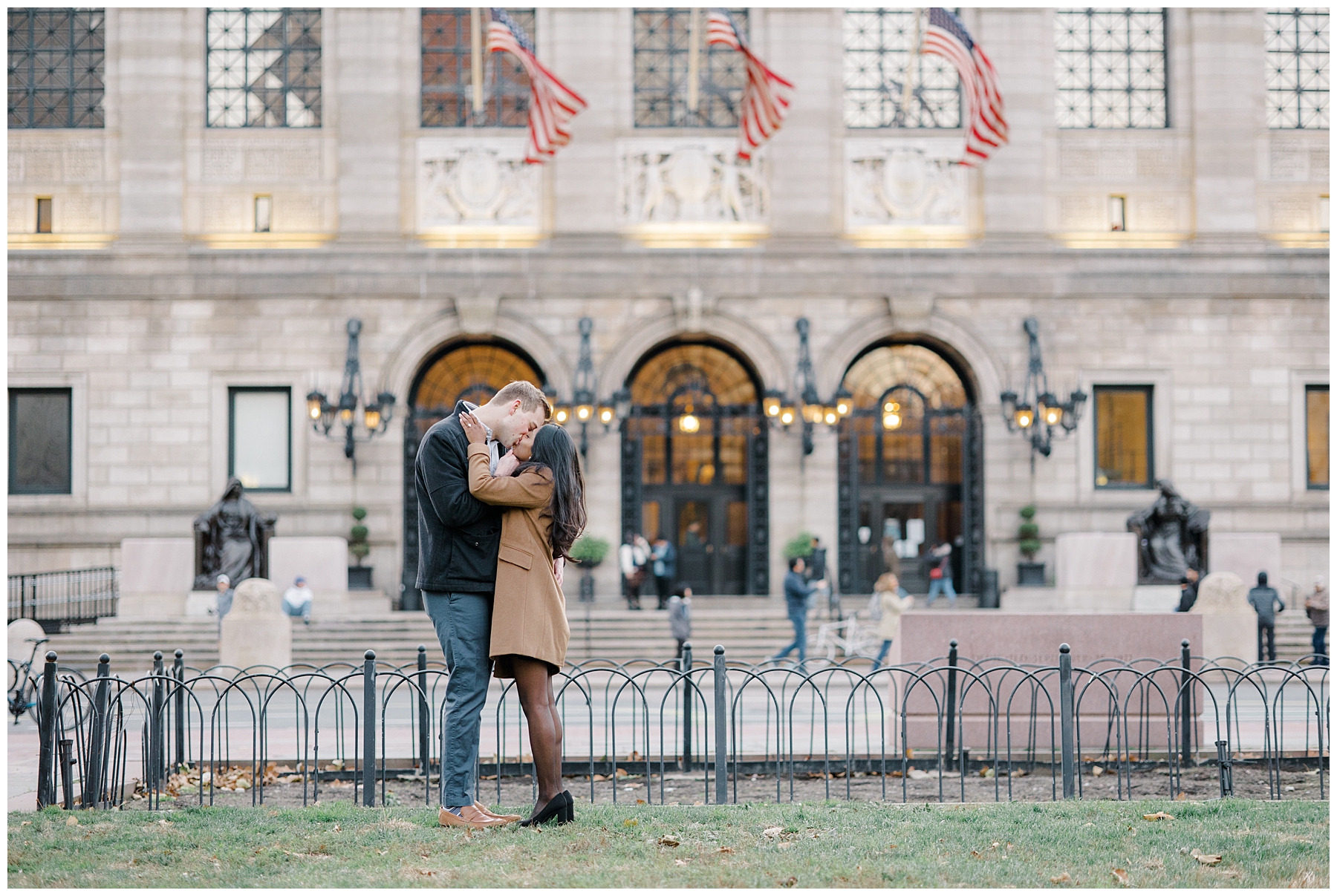 couple kiss in front of Boston Public Library