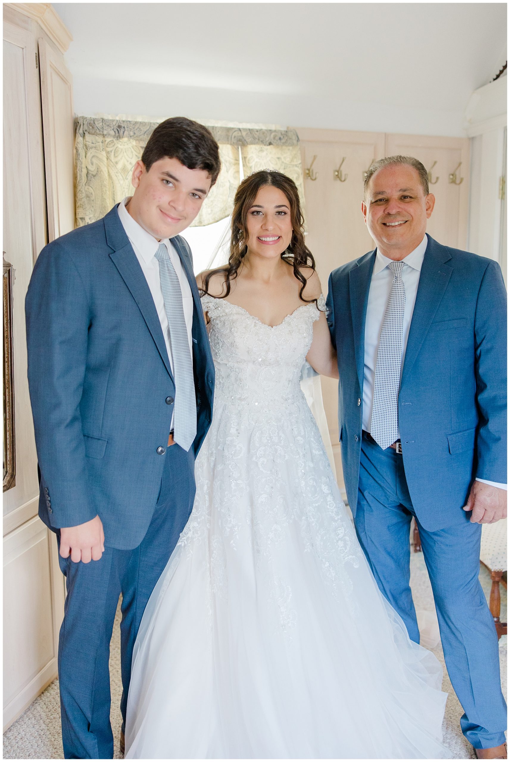 bride with her father and brother before wedding ceremony 