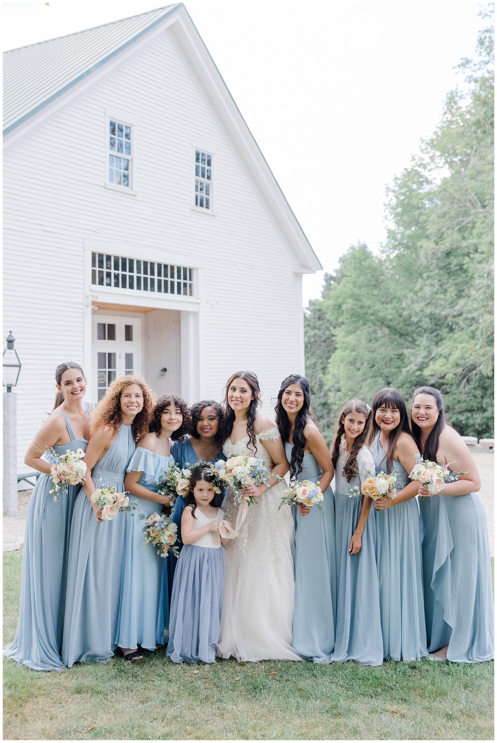 bride with bridesmaids in blue dreses