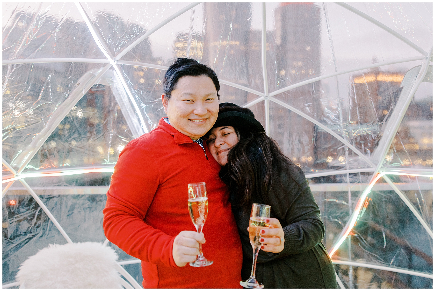 couple celebrate engagement with champagne