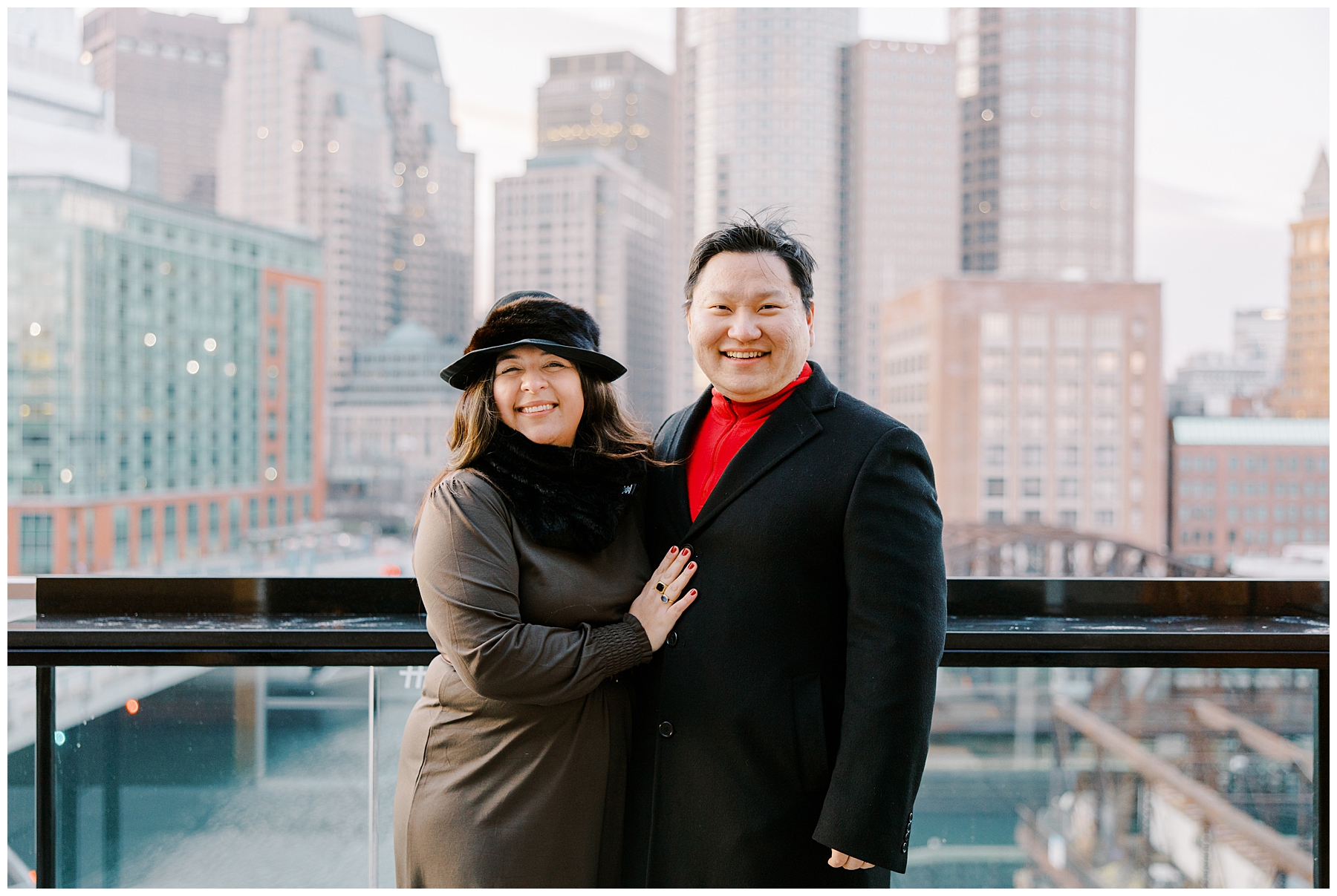couple portraits after proposal with boston skyline in background