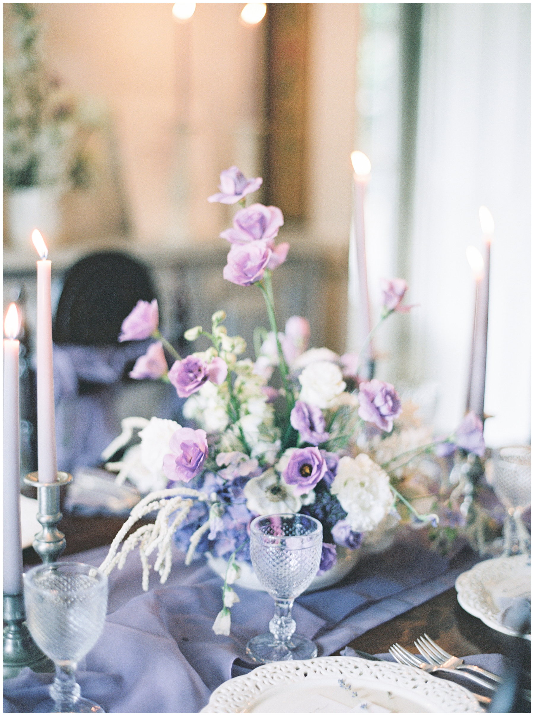 flower and candlestick centerpieces at intimate wedding celebration