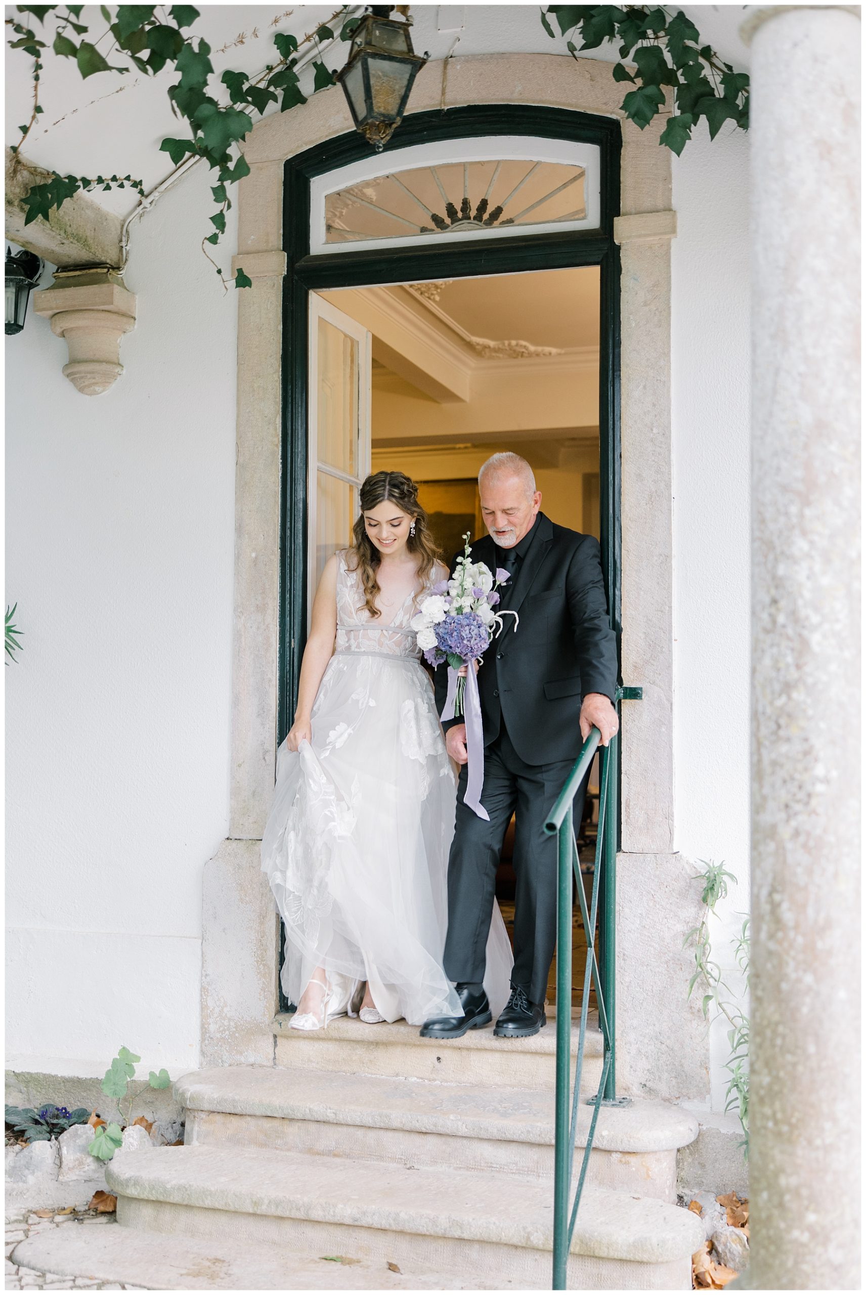 bride with father walking into wedding ceremony 