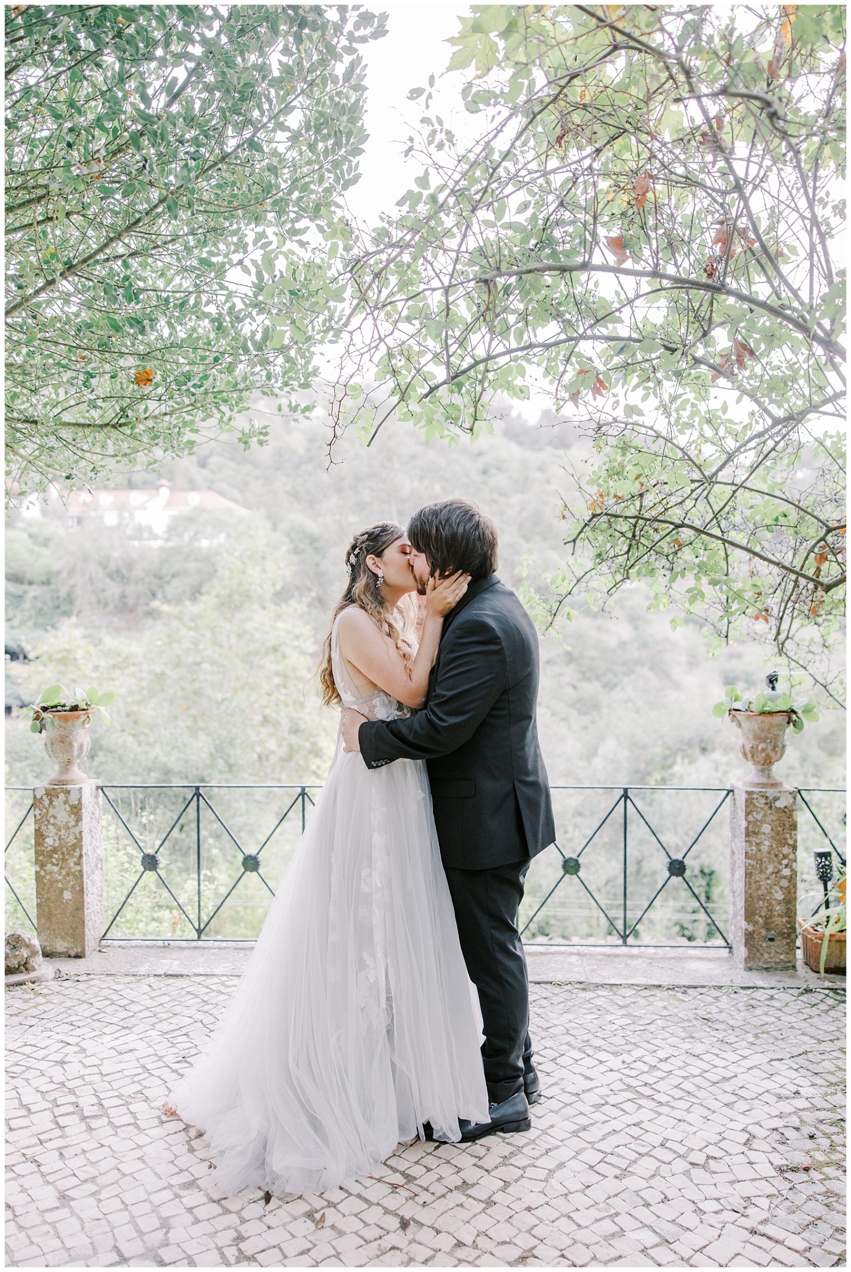 bride and groom kiss during destination wedding in Portugal 