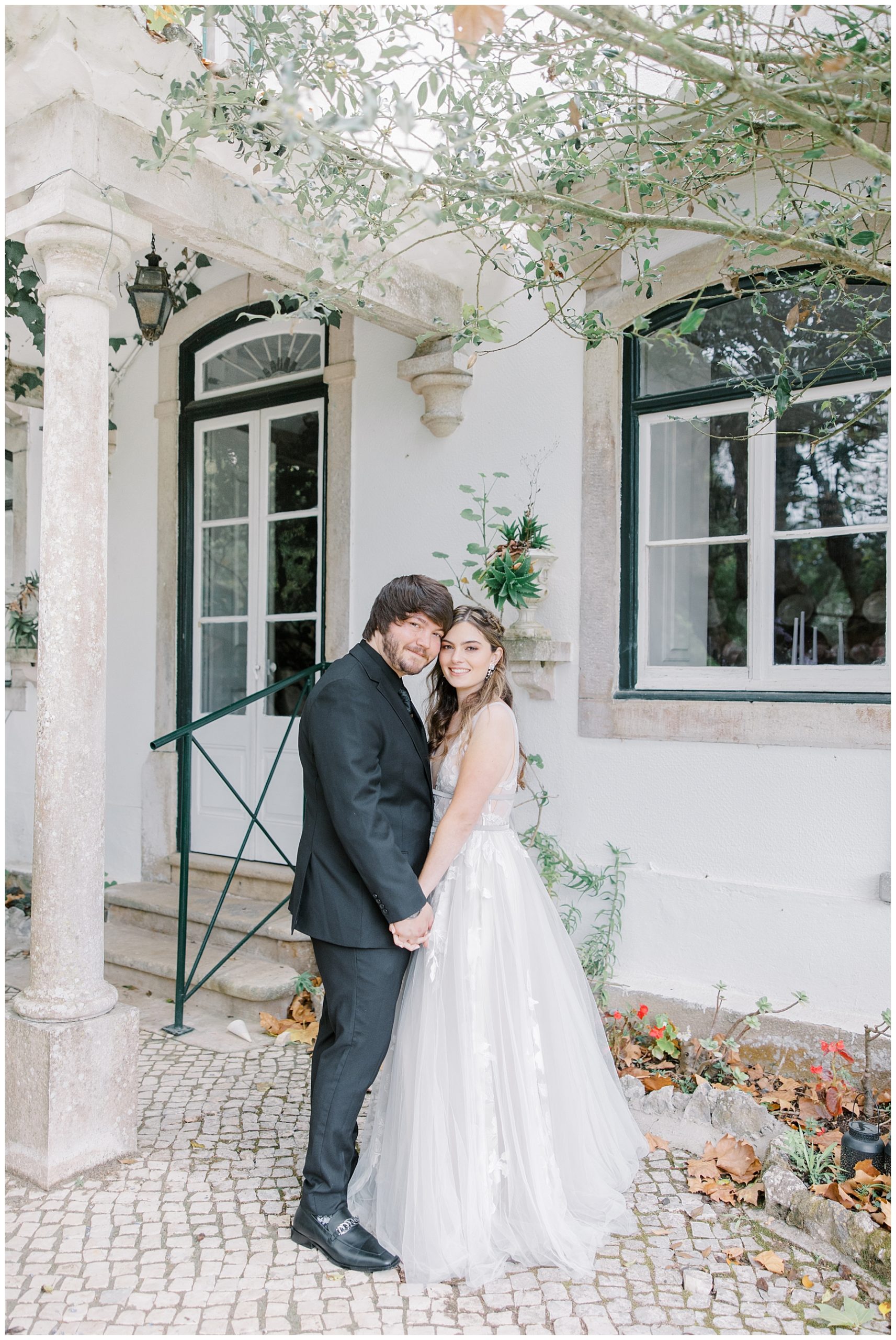 bride and groom in front of villa at Casa de Paderna in Portugal