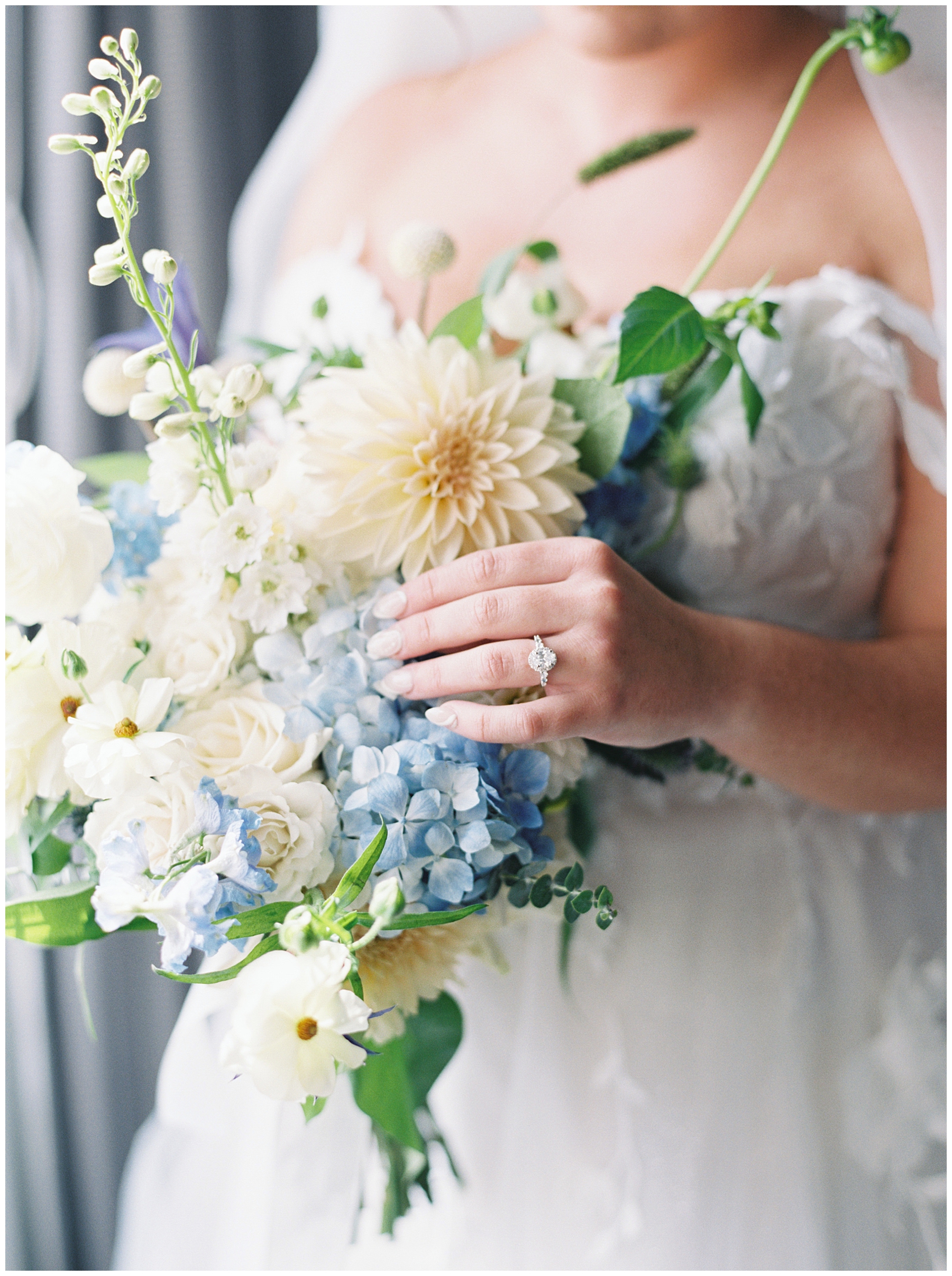 lightly hued white and blue wedding bouquet 