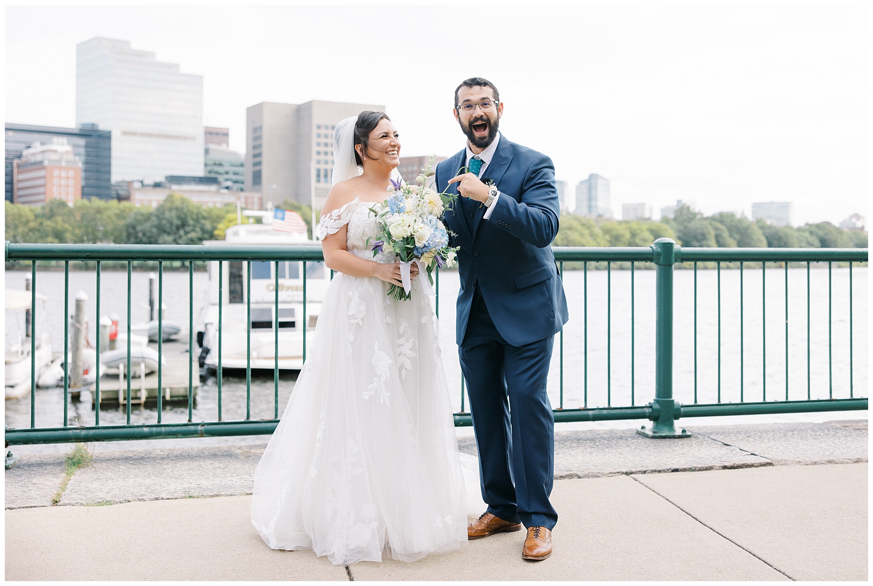 couple in front of Boston skyline during wedding portraits