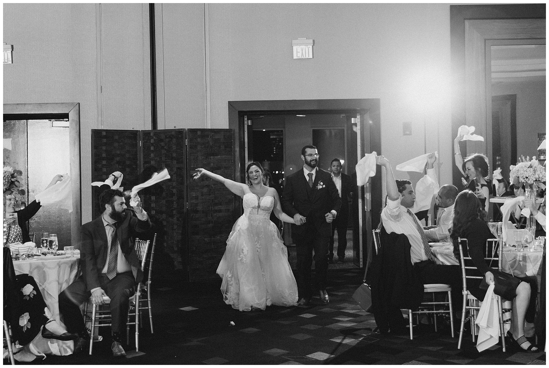 bride and groom enter wedding reception