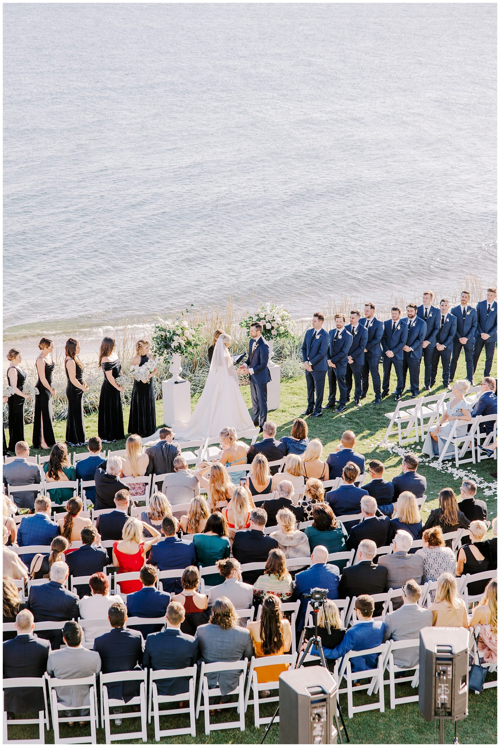 couple exchange vows by the ocean in Cape Cod, MA