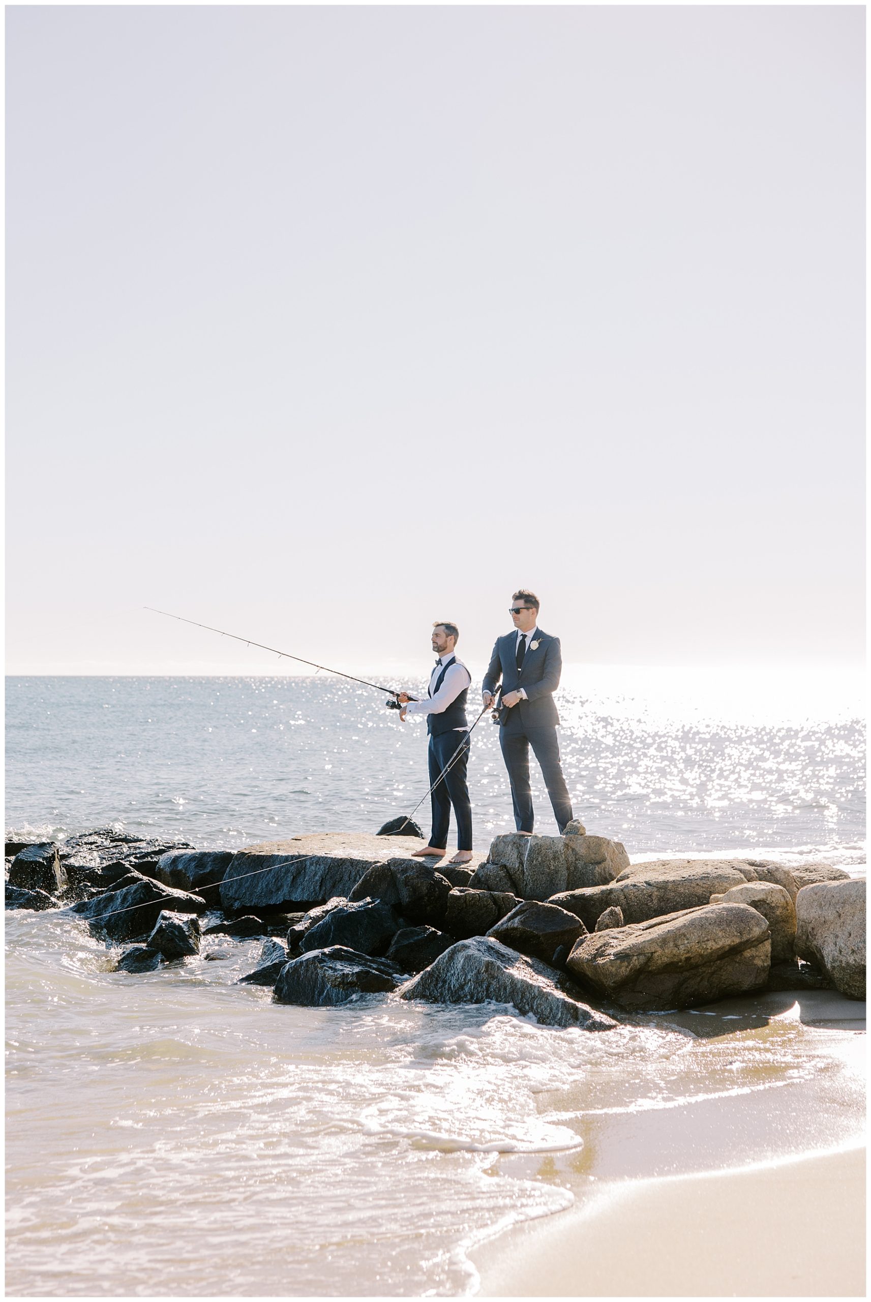 groom fishing off the coast before Cape Cod wedding