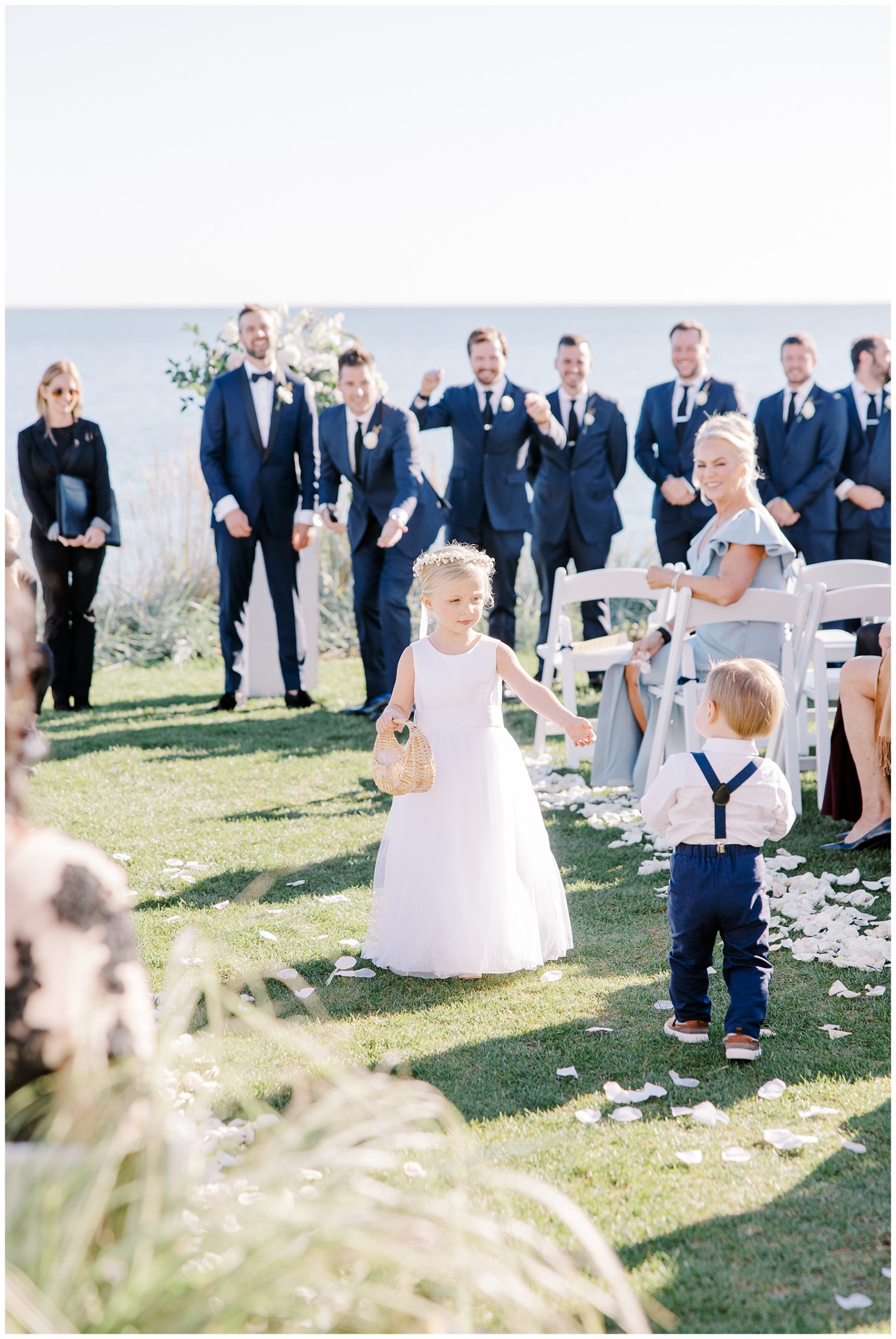 flower girl and ring bearer walk down aisle at Coastal Cape Cod Wedding at Pelham House Resort