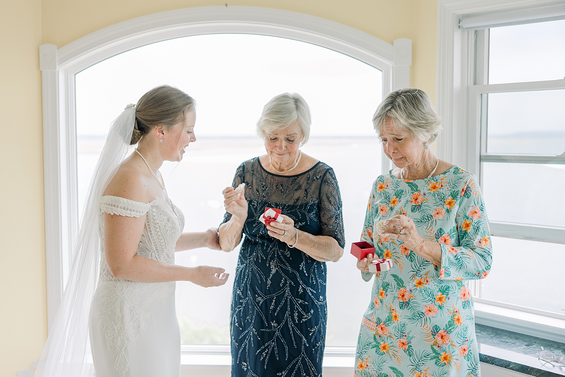 bride giving gift to grandmother at Timeless Family Heirloom Focused Wedding 