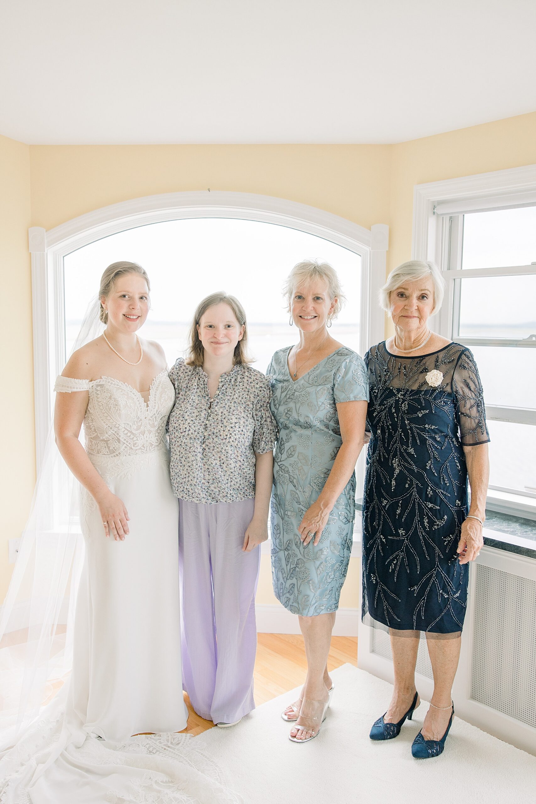bride with family while getting ready for Timeless Family Heirloom Focused Wedding 