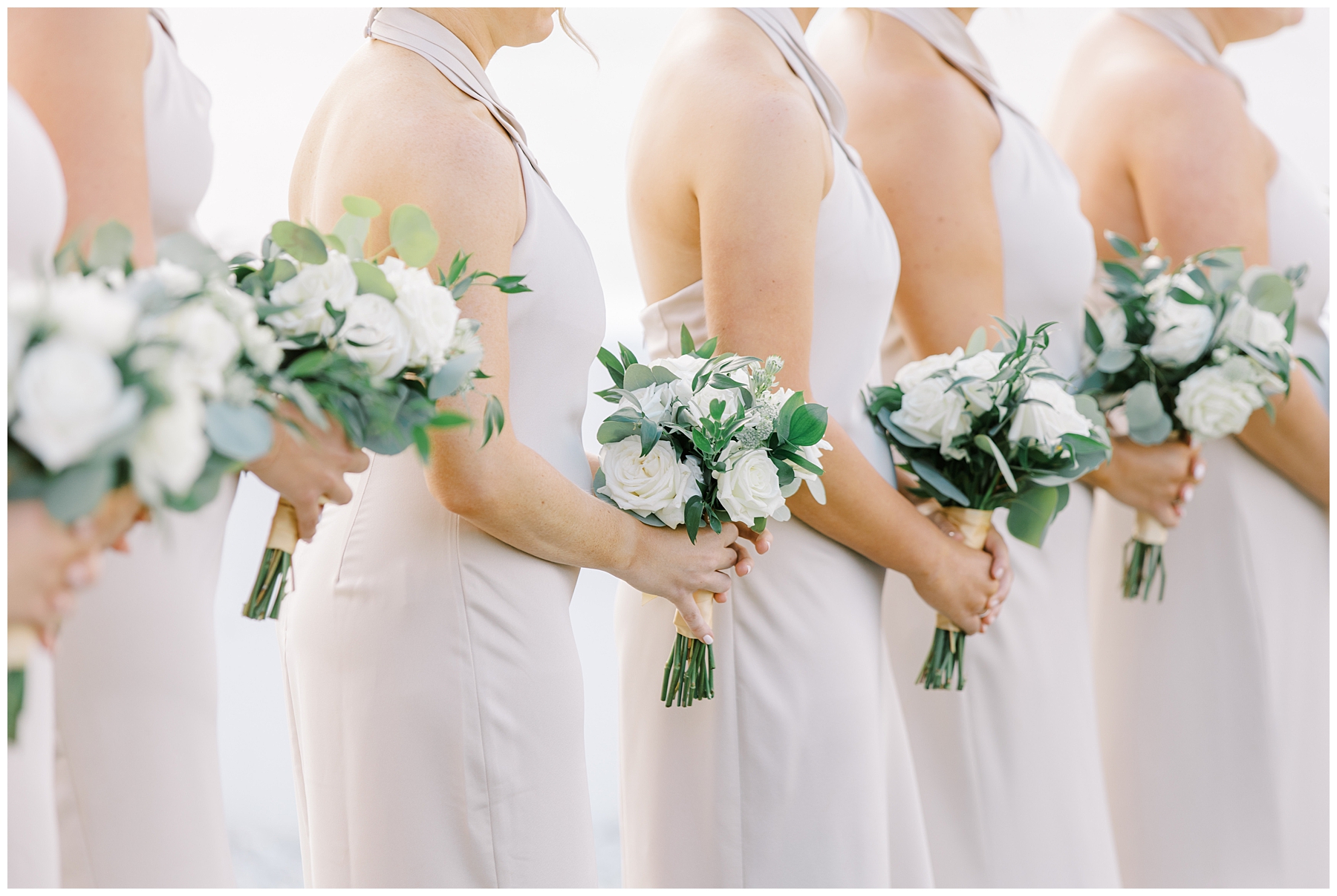 bridesmaids holding classic white bouquet
